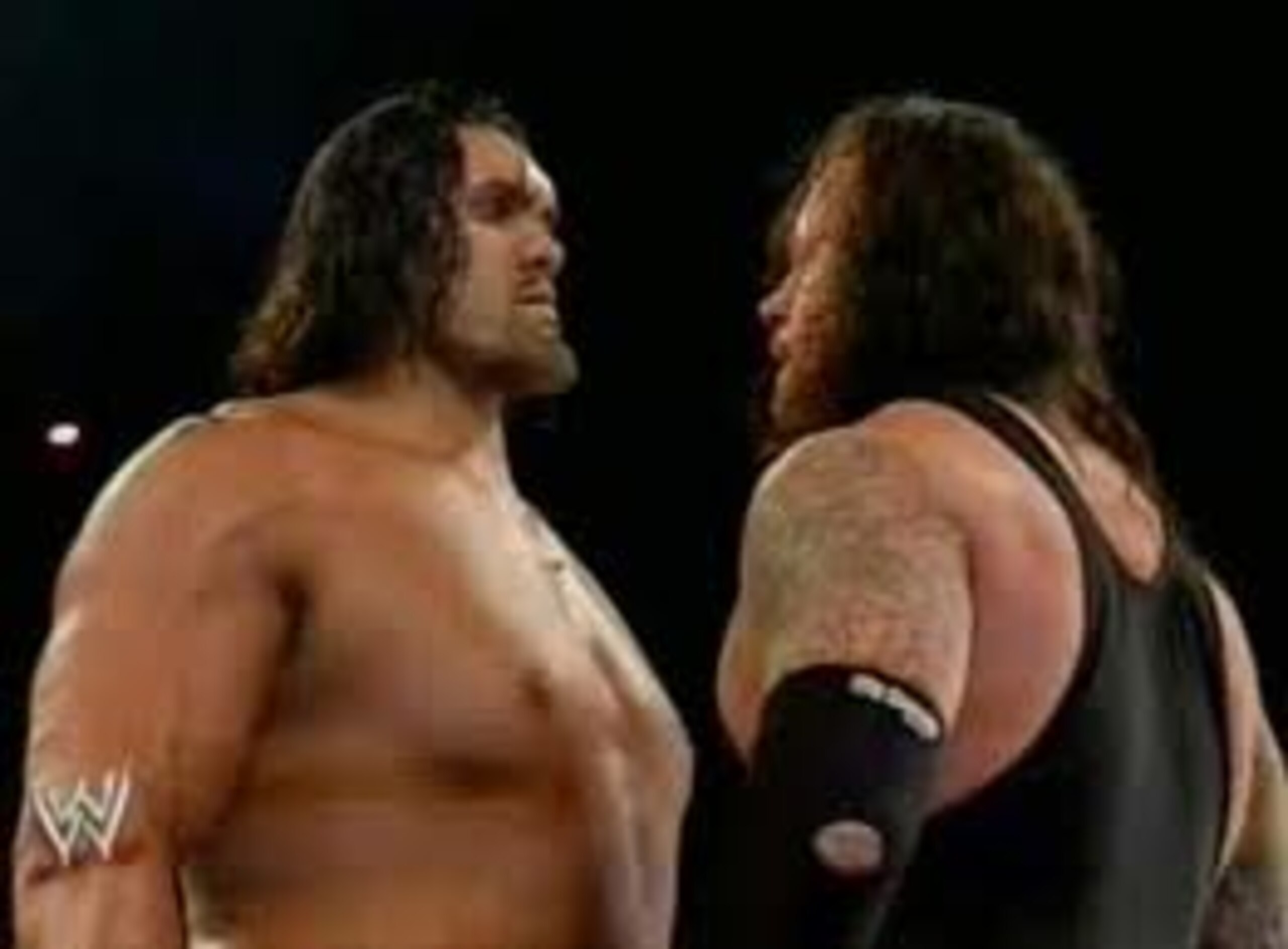 The Great Khali Stands Eye-to-Eye with the Undertaker The Great Khali Stands Eye-to-Eye with the Undertaker