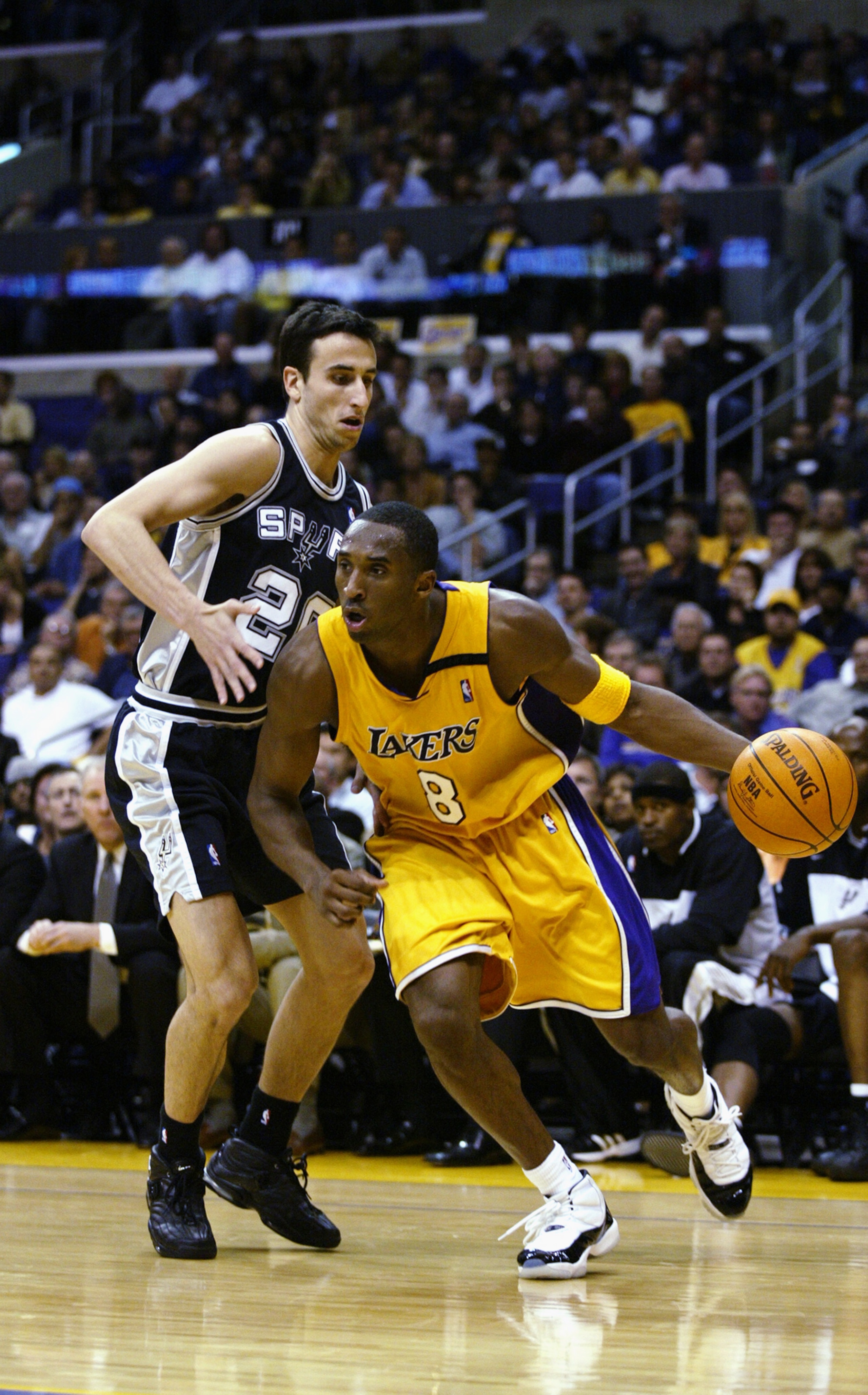 LOS ANGELES - OCTOBER 29: Kobe Bryant #8 of the Los Angeles Lakers drives past Emanuel Ginobili #20 of the San Antonio Spurs during the game at Staples Center on October 29, 2002 in Los Angeles, California. The Spurs won 87-82. NOTE TO USER: User expre LOS ANGELES - OCTOBER 29: Kobe Bryant #8 of the Los Angeles Lakers drives past Emanuel Ginobili #20 of the San Antonio Spurs during the game at Staples Center on October 29, 2002 in Los Angeles, California. The Spurs won 87-82. NOTE TO USER: User expre