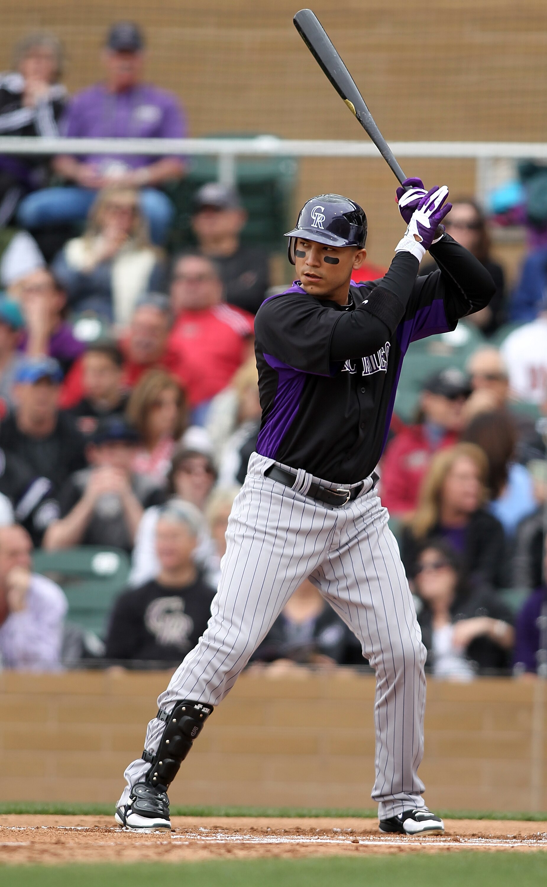 SCOTTSDALE, AZ - FEBRUARY 26:  Carlos Gonzalez #5 of the Colorado Rockies swings during the game against the Arizona Diamondbacks at Salt River Fields on February 26, 2011in Scottsdale, Arizona..  (Photo by Jonathan Ferrey/Getty Images)