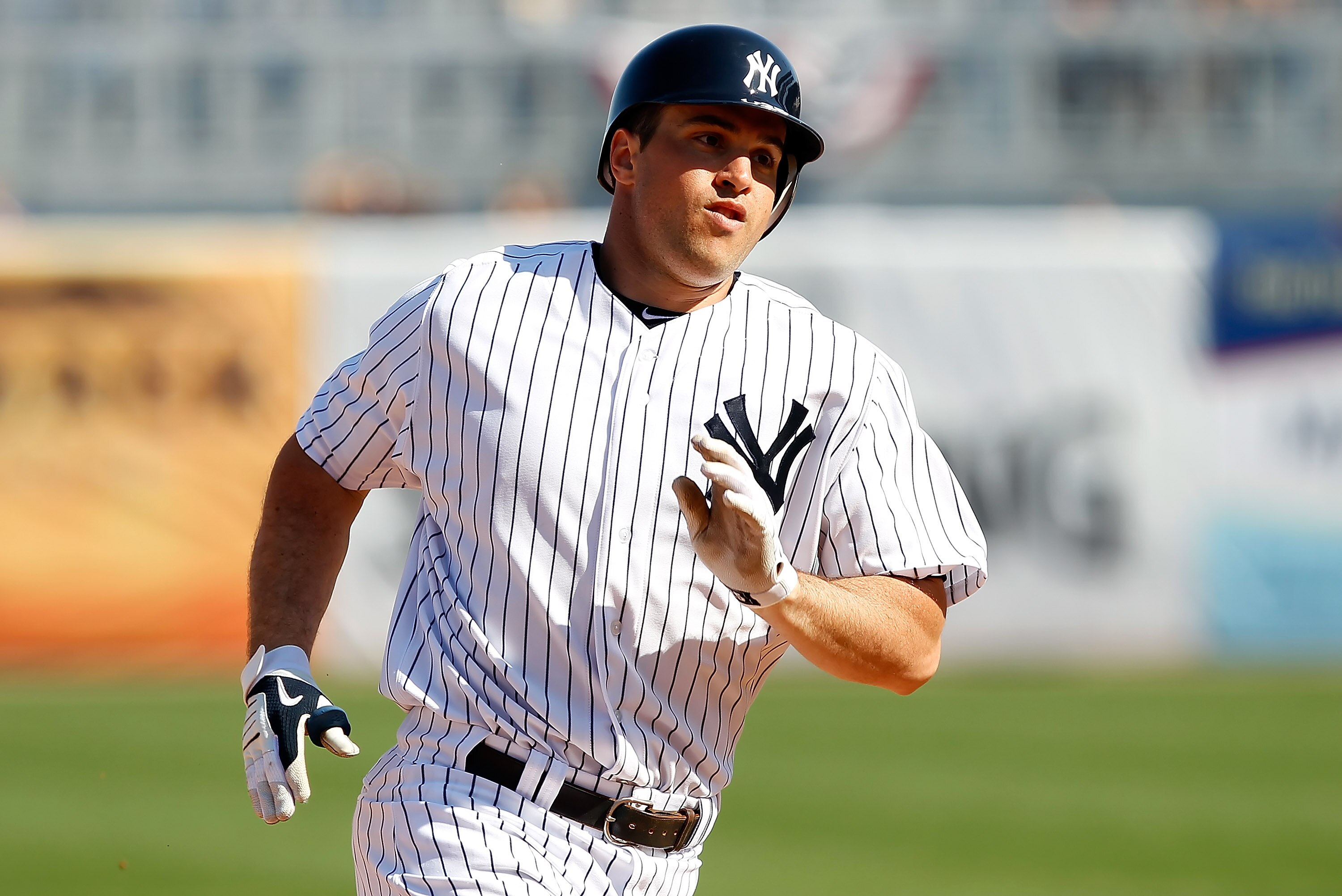 TAMPA, FL - FEBRUARY 26:  Infielder Mark Teixeira #25 of the New York Yankees triples in the fifth inning against the Philadelphia Phillies during a Grapefruit League Spring Training Game at George M. Steinbrenner Field on February 26, 2011 in Tampa, Flor