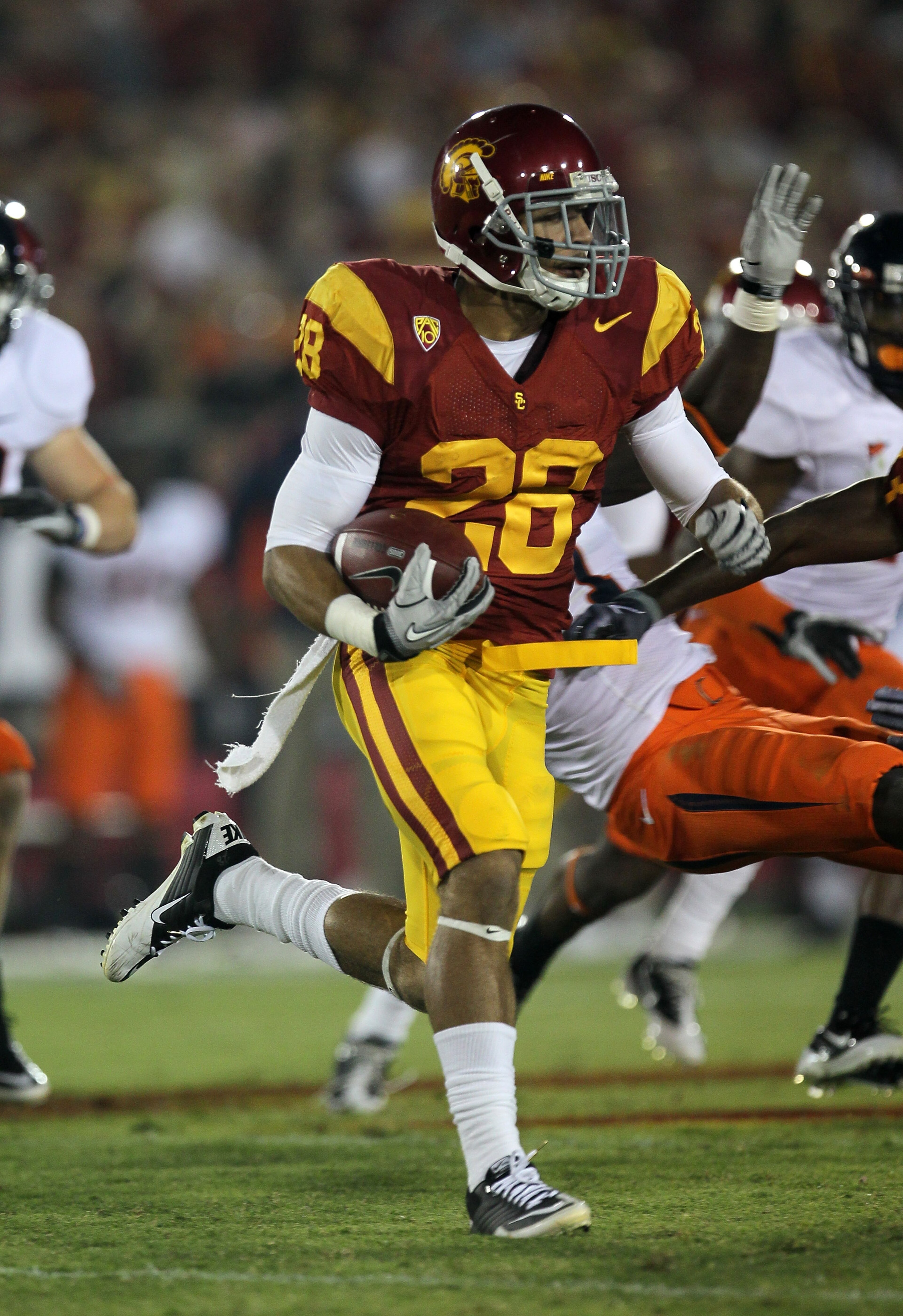 LOS ANGELES, CA - SEPTEMBER 11:  Running back Dillon Baxter #28 of the USC Trojans carries the ball against the Virginia Cavaliers at Los Angeles Memorial Coliseum on September 11, 2010 in Los Angeles, California. USC won 17-14.  (Photo by Stephen Dunn/Ge