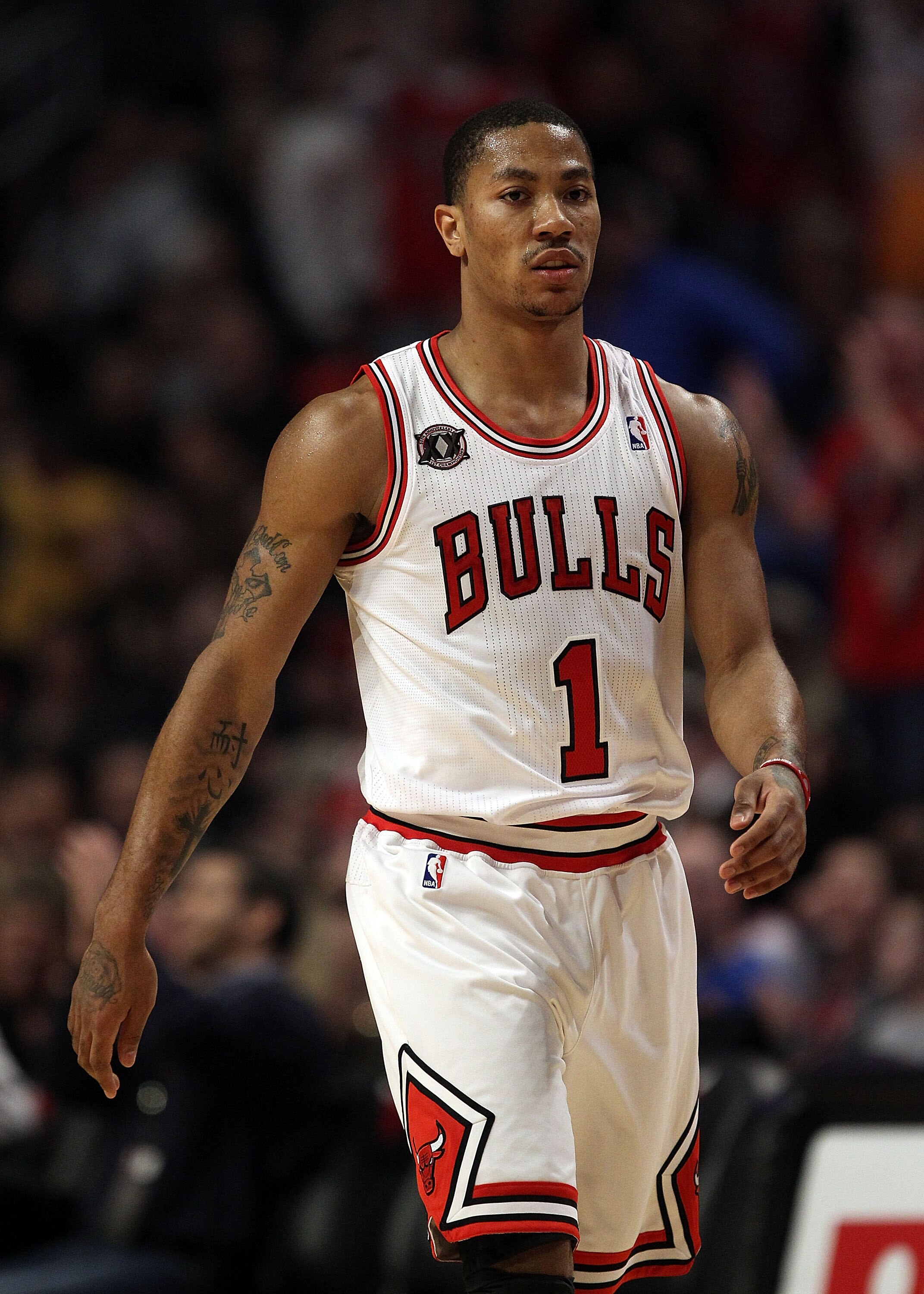 CHICAGO, IL - MARCH 12: Derrick Rose #1 of the Chicago Bulls walks back to the bench after hitting a 3 point shot against the Utah Jazz at the United Center on March 12, 2011 in Chicago, Illinois. The Bulls defeated the Jazz 118-100. NOTE TO USER: User ex CHICAGO, IL - MARCH 12: Derrick Rose #1 of the Chicago Bulls walks back to the bench after hitting a 3 point shot against the Utah Jazz at the United Center on March 12, 2011 in Chicago, Illinois. The Bulls defeated the Jazz 118-100. NOTE TO USER: User ex