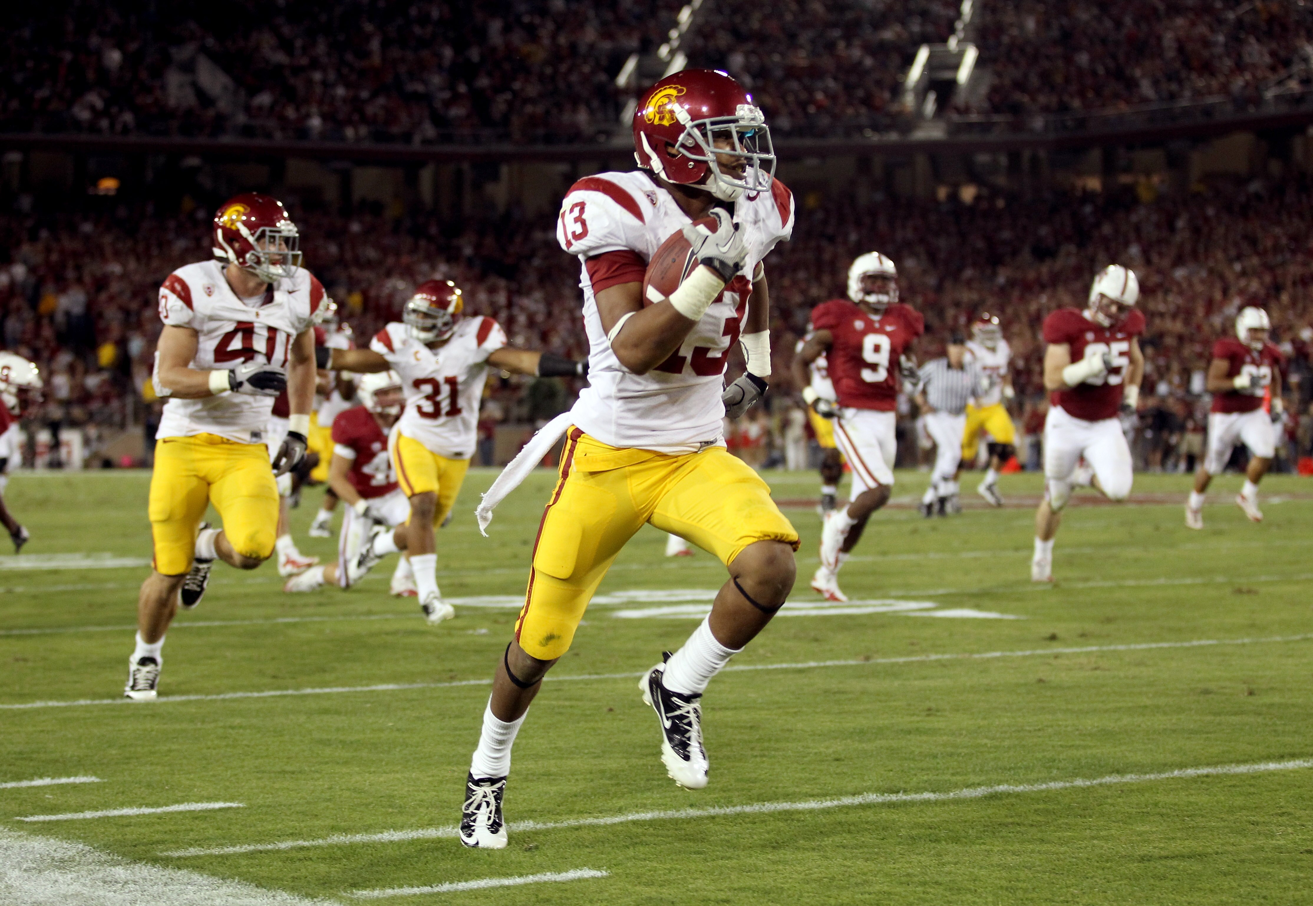 PALO ALTO, CA - OCTOBER 09:  Robert Woods #13 of the USC Trojans runs the ball in for a touchdown against the Stanford Cardinal at Stanford Stadium on October 9, 2010 in Palo Alto, California.  (Photo by Ezra Shaw/Getty Images)