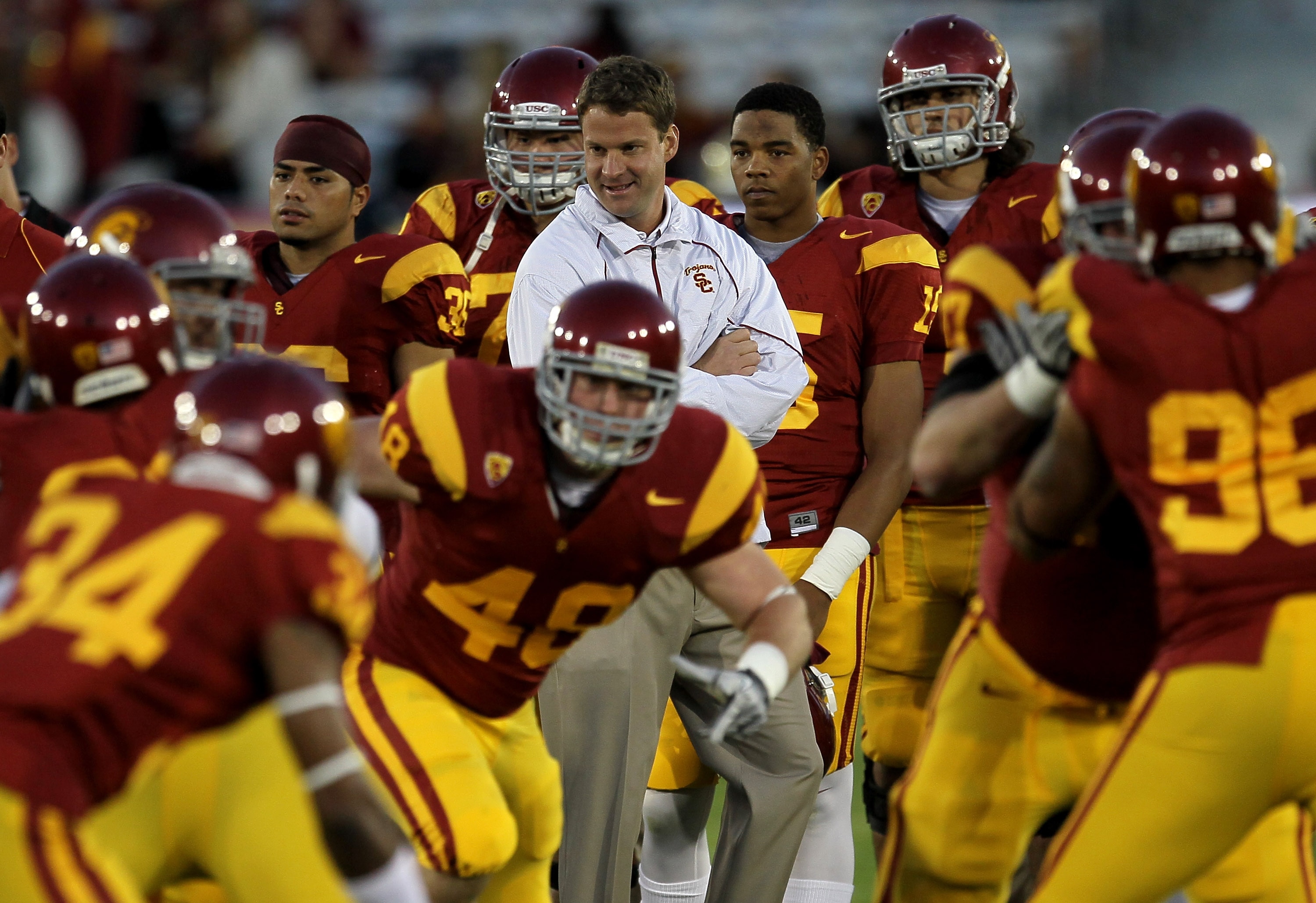 LOS ANGELES - NOVEMBER 27:  Head coach Lane Kiffin of the USC Trojans watches warmups for the game with the Notre Dame Fighting Irish at the Los Angeles Memorial Coliseum on November 27, 2010 in Los Angeles, California.   (Photo by Stephen Dunn/Getty Imag