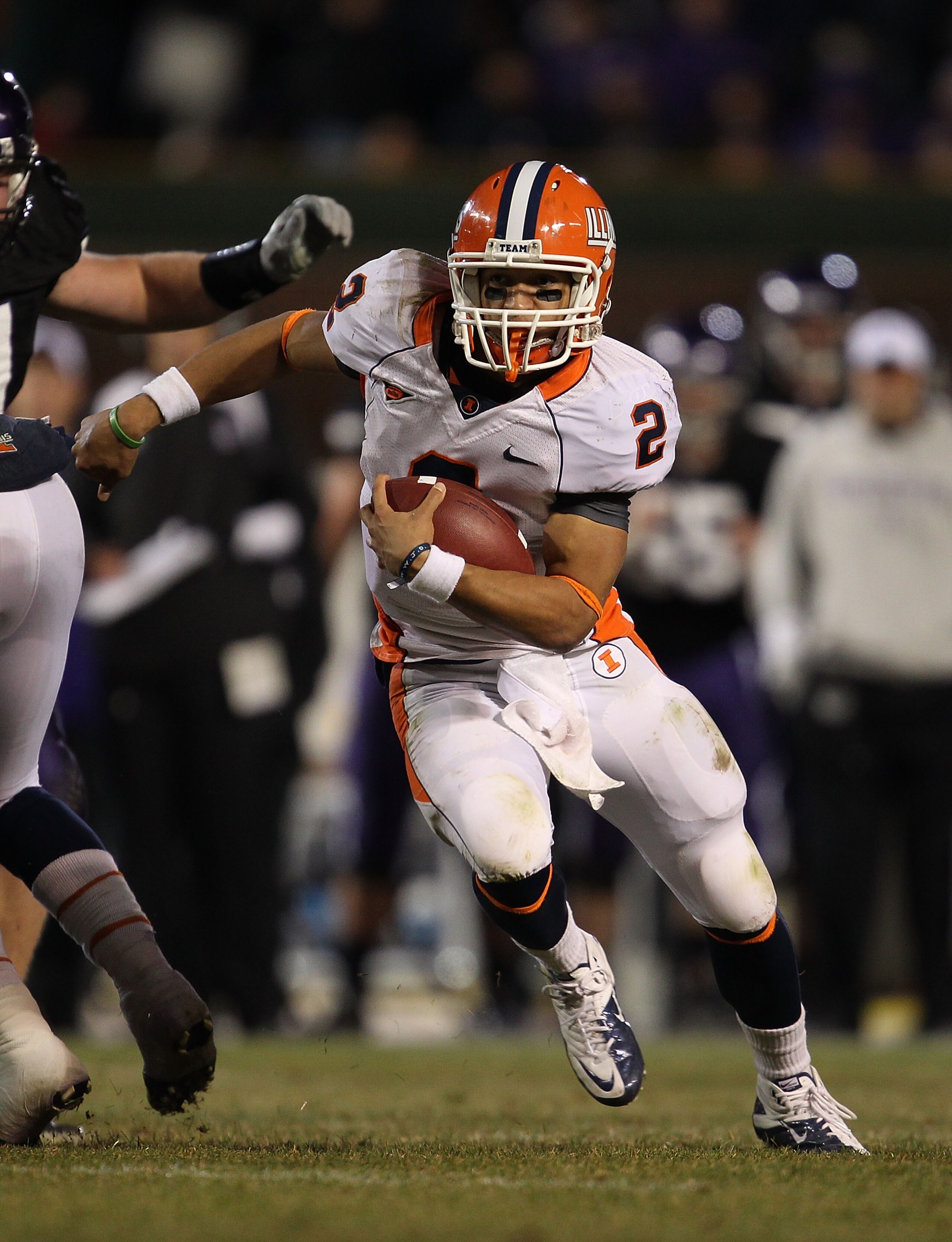 CHICAGO, IL - NOVEMBER 20: Nathan Scheelhasse #2 of the Illinois Fighting Illini runs against the Northwestern Wildcats during a game played at Wrigley Field on November 20, 2010 in Chicago, Illinois. Illinois defeated Northwestern 48-27. (Photo by Jonath
