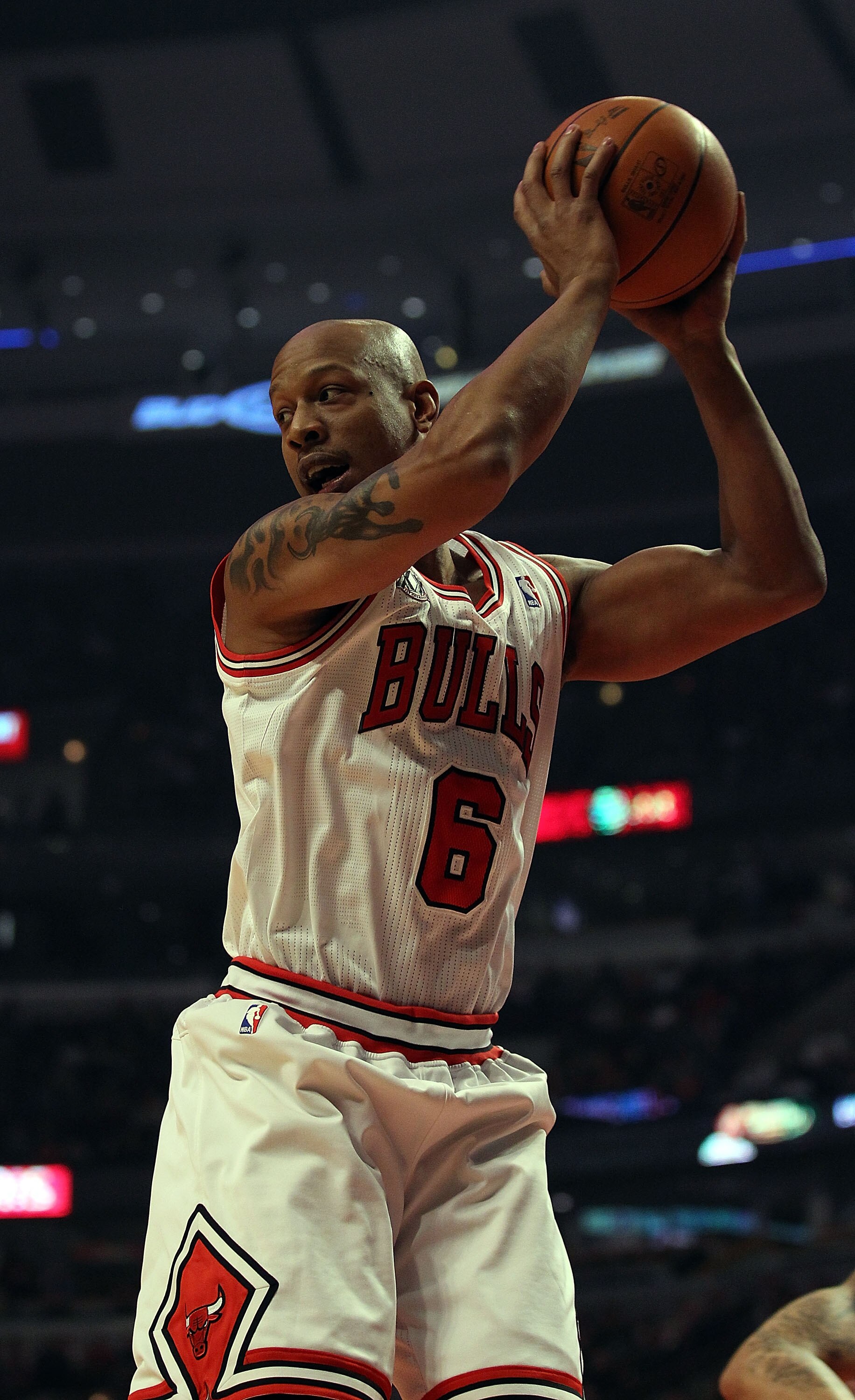 CHICAGO, IL - DECEMBER 21: Keith Bogans #6 of the Chicago Bulls grabs a rebound against the Philadelphia 76ers at the United Center on December 21, 2010 in Chicago, Illinois. The Bulls defeated the 76ers 121-76. NOTE TO USER: User expressly acknowledges a CHICAGO, IL - DECEMBER 21: Keith Bogans #6 of the Chicago Bulls grabs a rebound against the Philadelphia 76ers at the United Center on December 21, 2010 in Chicago, Illinois. The Bulls defeated the 76ers 121-76. NOTE TO USER: User expressly acknowledges a