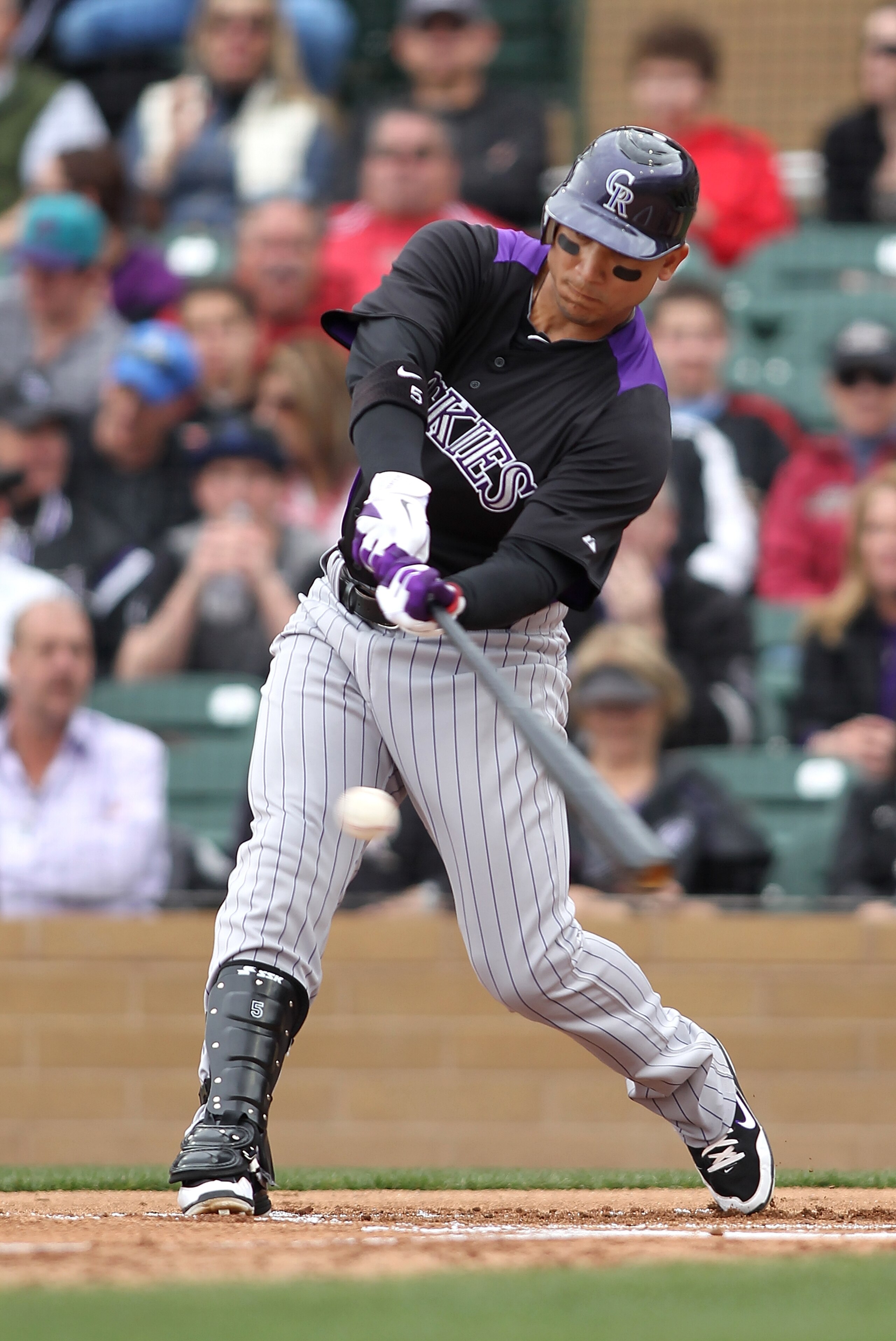 SCOTTSDALE, AZ - FEBRUARY 26: Carlos Gonzalez #5 of the Colorado Rockies swings during the game against the Arizona Diamondbacks at Salt River Fields on February 26, 2011in Scottsdale, Arizona.. (Photo by Jonathan Ferrey/Getty Images) SCOTTSDALE, AZ - FEBRUARY 26: Carlos Gonzalez #5 of the Colorado Rockies swings during the game against the Arizona Diamondbacks at Salt River Fields on February 26, 2011in Scottsdale, Arizona.. (Photo by Jonathan Ferrey/Getty Images)