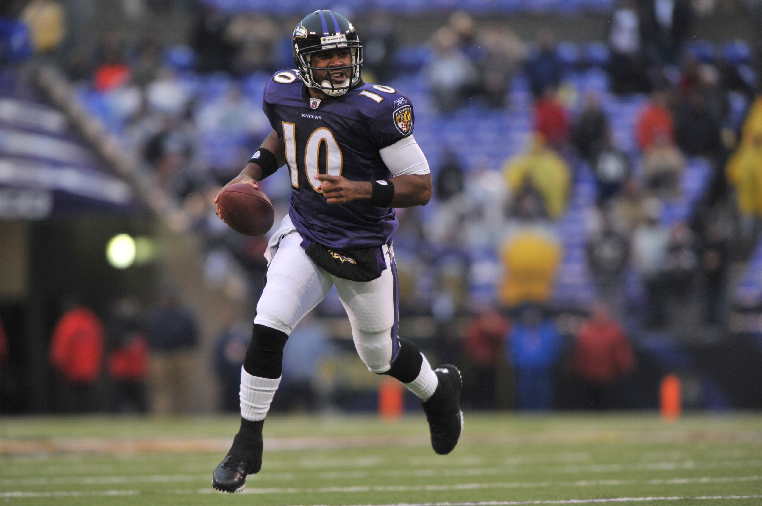 BALTIMORE - DECEMBER 13:  Troy Smith #10 of the Baltimore Ravens runs the ball n for a touchdown against the Detroit Lions at M&T Bank Stadium on December 13, 2009 in Baltimore, Maryland. The Ravens defeated the Lions 48-3. (Photo by Larry French/Getty Im