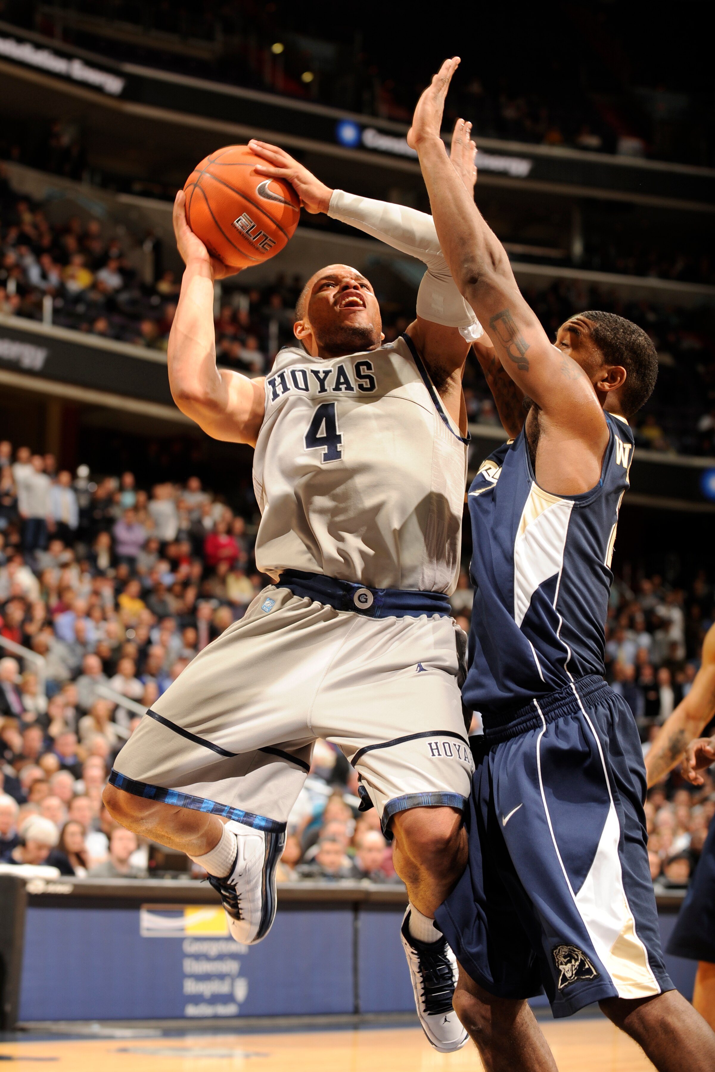 WASHINGTON, DC- JANUARY 12:  Chris Wright #4 of the Georgetown Hoya drives to basket during a college basketball game against the Pittsburgh Panthers on January 12, 2011 at the Verizon Center in Washington, DC.   The Panthers won 72-57.  (Photo by Mitchel