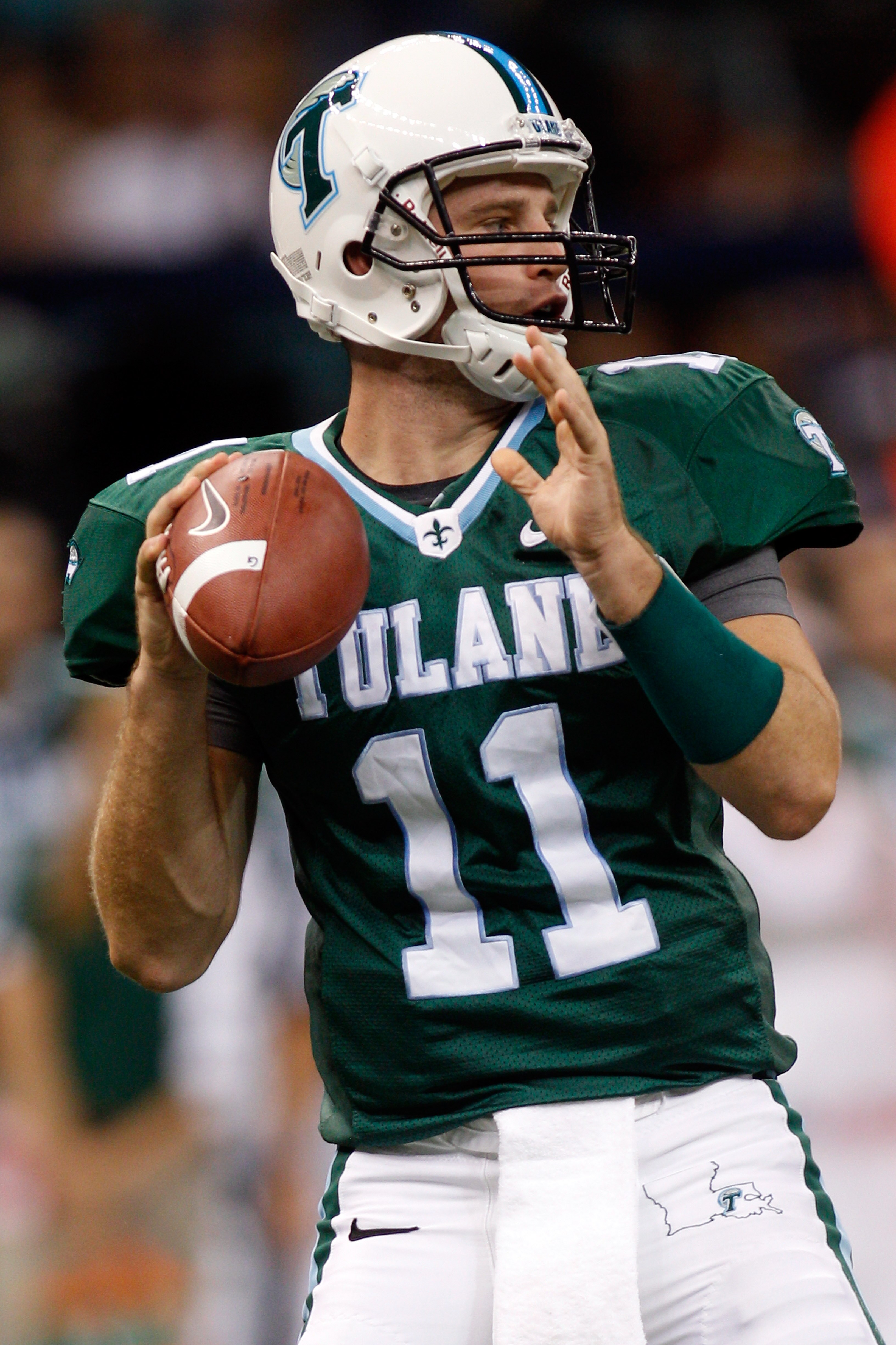 NEW ORLEANS - SEPTEMBER 11:  Ryan Griffin #11 of the Tulane Green Wave looks to throw a pass against the Ole Miss Rebels at the Louisiana Superdome on September 11, 2010 in New Orleans, Louisiana.  (Photo by Chris Graythen/Getty Images)
