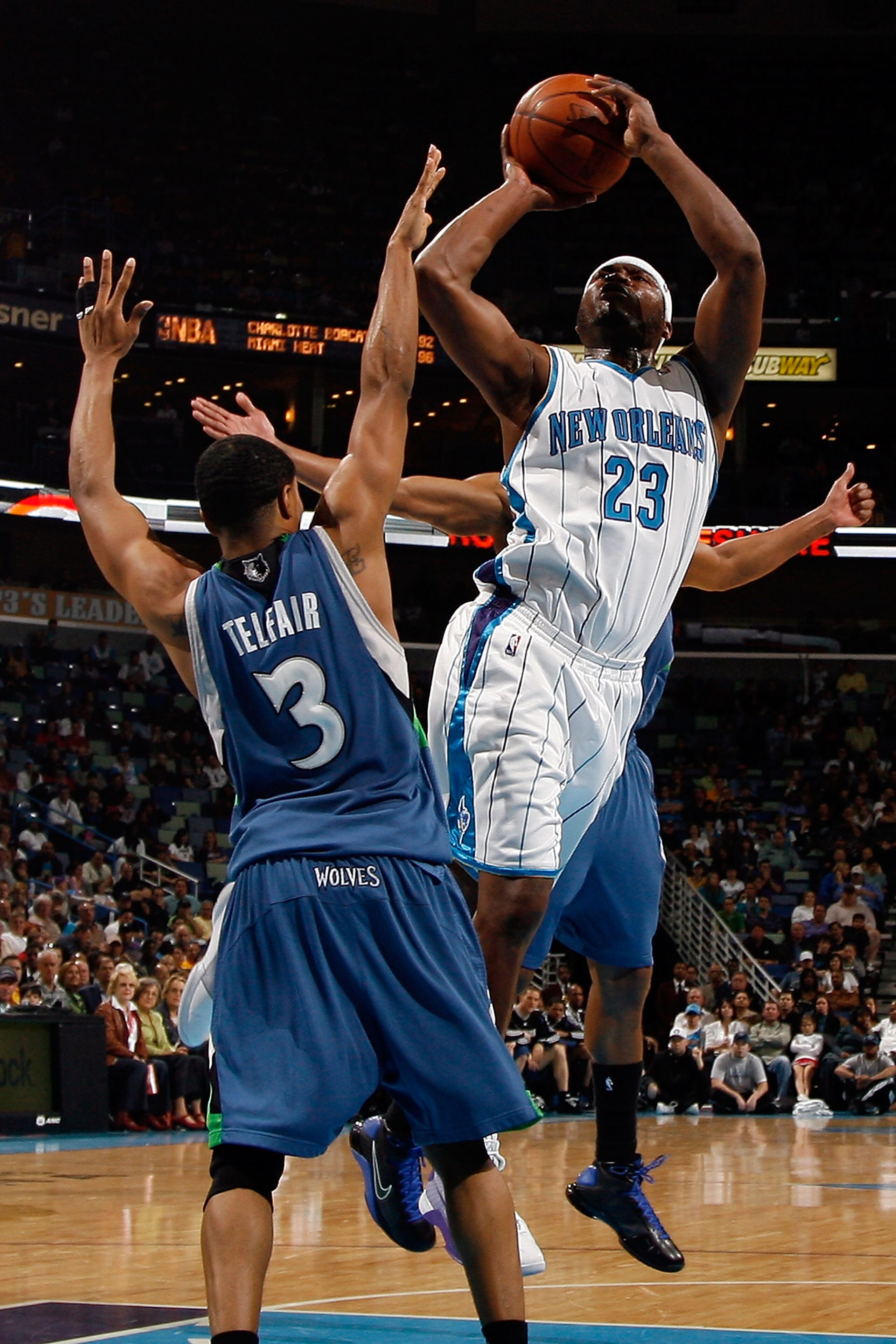 NEW ORLEANS - FEBRUARY 08:  Devin Brown #23 of the New Orleans Hornets makes a shot over Sebastian Telfair #3 of the Minnesota Timberwolves on February 8, 2009 in New Orleans, Louisiana.  The Hornets defeated the Timberwolves 101-97.  NOTE TO USER: User e