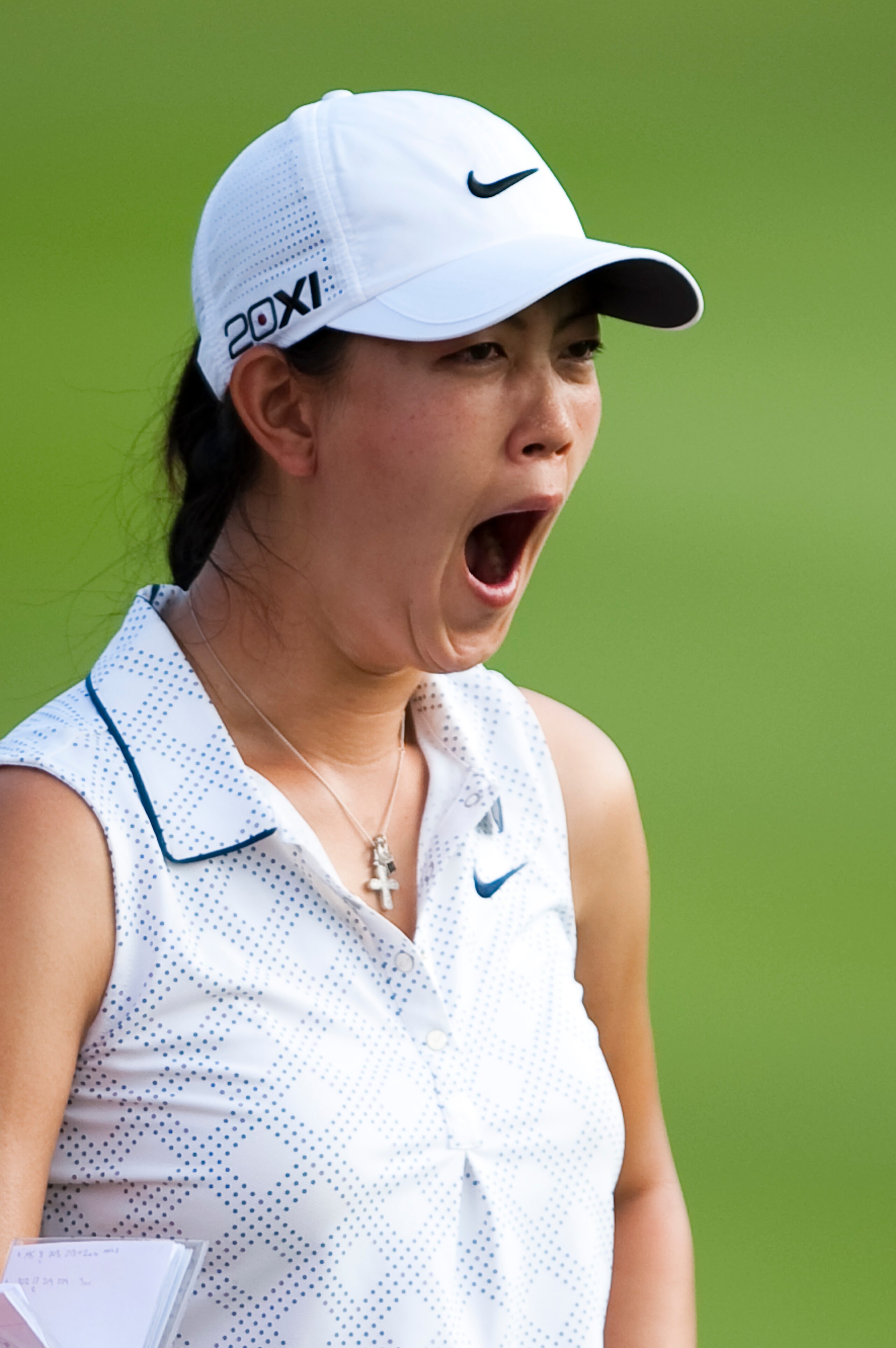 CHON BURI, THAILAND - FEBRUARY 17:  Michelle Wie of USA yawns on the 18th hole during day one of the LPGA Thailand at Siam Country Club on February 17, 2011 in Chon Buri, Thailand.  (Photo by Victor Fraile/Getty Images)