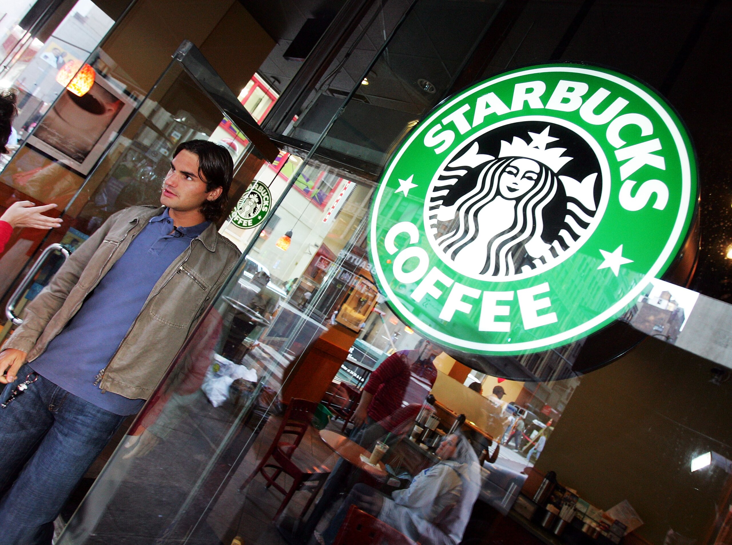 NEW YORK - SEPTEMBER 13:   Roger Federer of Switzerland leaves a Starbucks Coffee in between morning talk show apparences on September 13, 2004 in New York City. Federer defeated Lleyton Hewitt of Australia yesterday to win the US Open and his third Grand