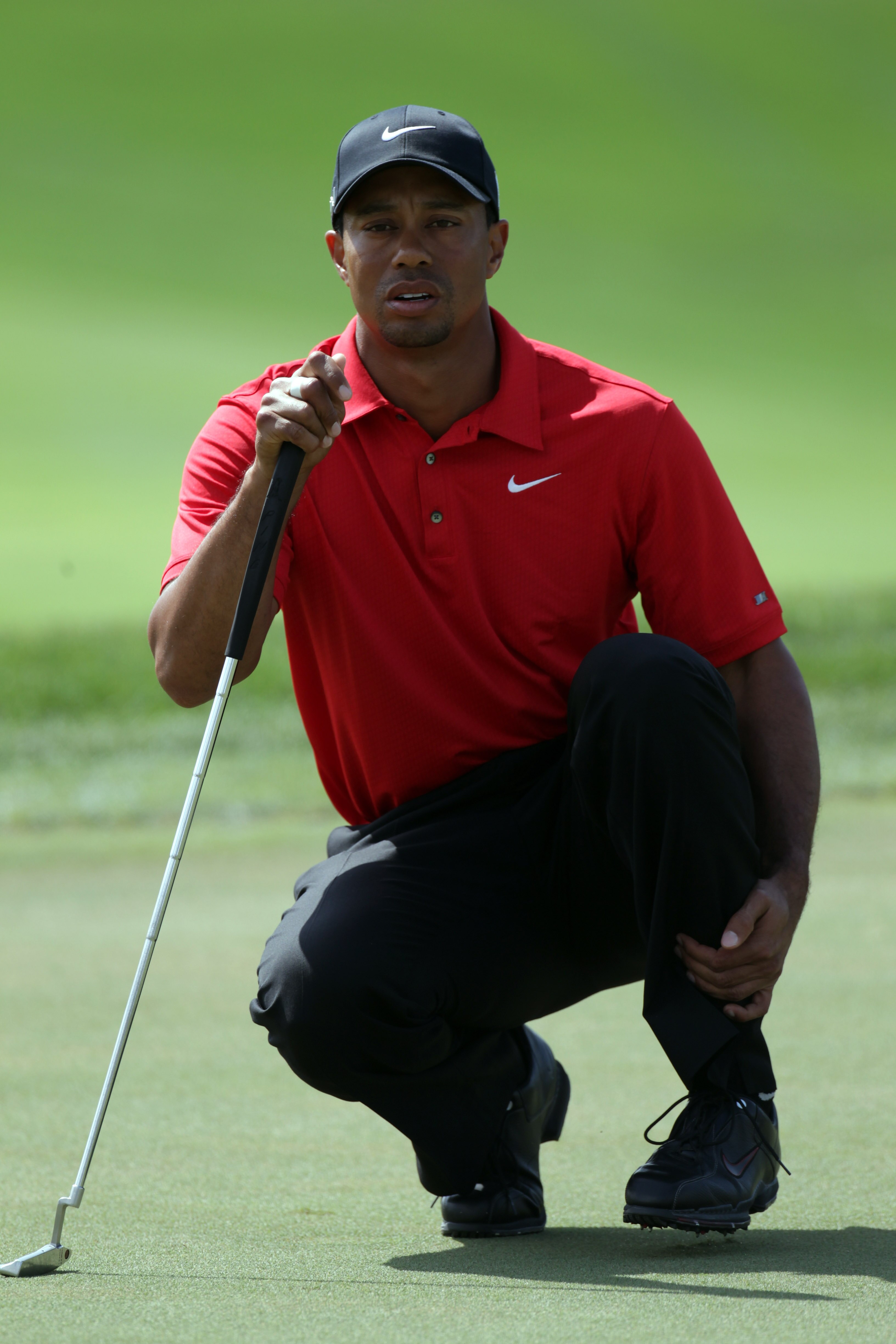 DUBAI, UNITED ARAB EMIRATES - FEBRUARY 13:  Tiger Woods of the USA during the final round of the Omega Dubai Desert Classic on the Majlis course at the Emirates Golf Club on February 13, 2011 in Dubai, United Arab Emirates.  (Photo by Ross Kinnaird/Getty