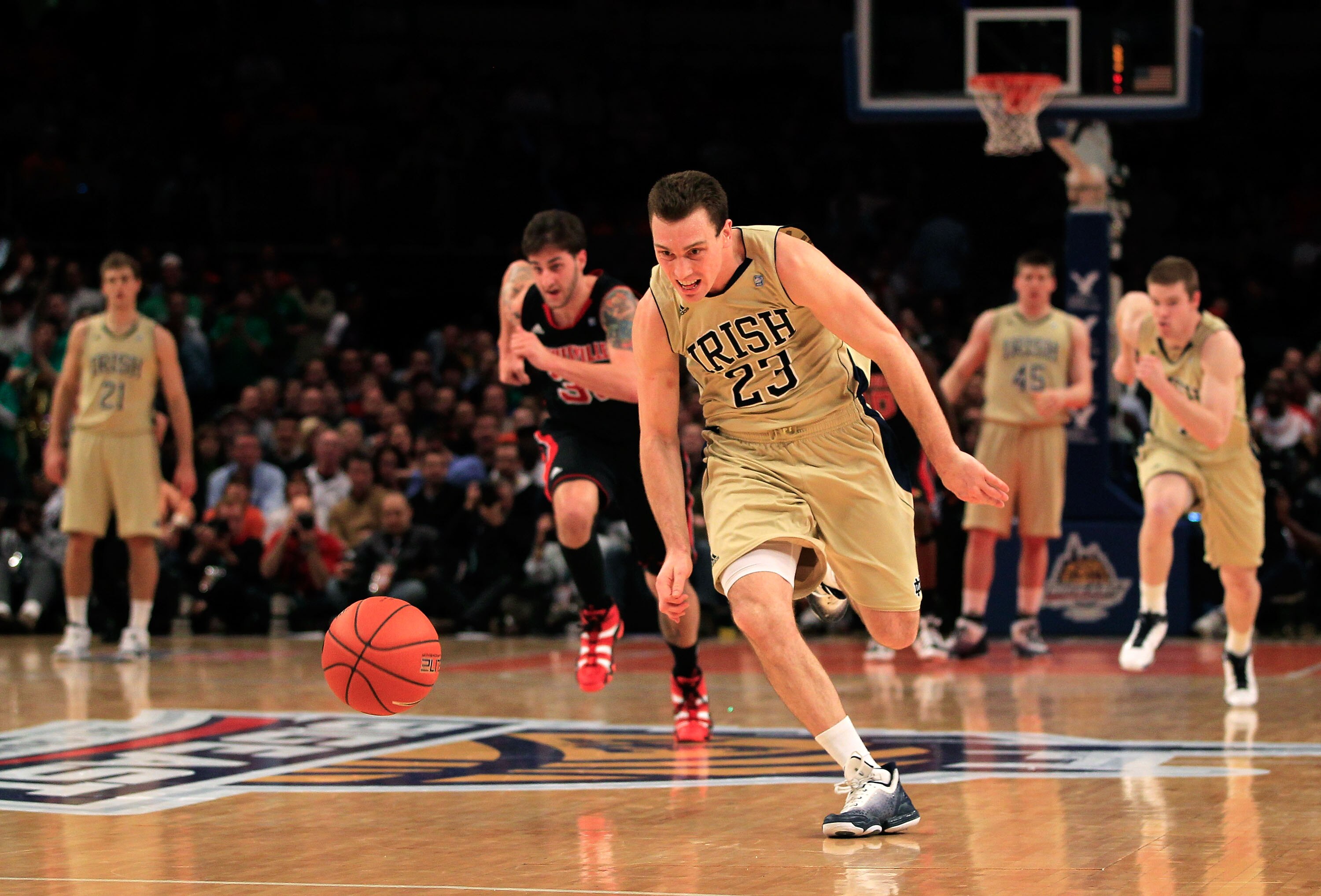 NEW YORK, NY - MARCH 11: Ben Hansbrough #23 of the Notre Dame Fighting Irish runs down a loose ball against the Louisville Cardinals during the semifinals of the 2011 Big East Men's Basketball Tournament presented by American Eagle Outfitters at Madison S