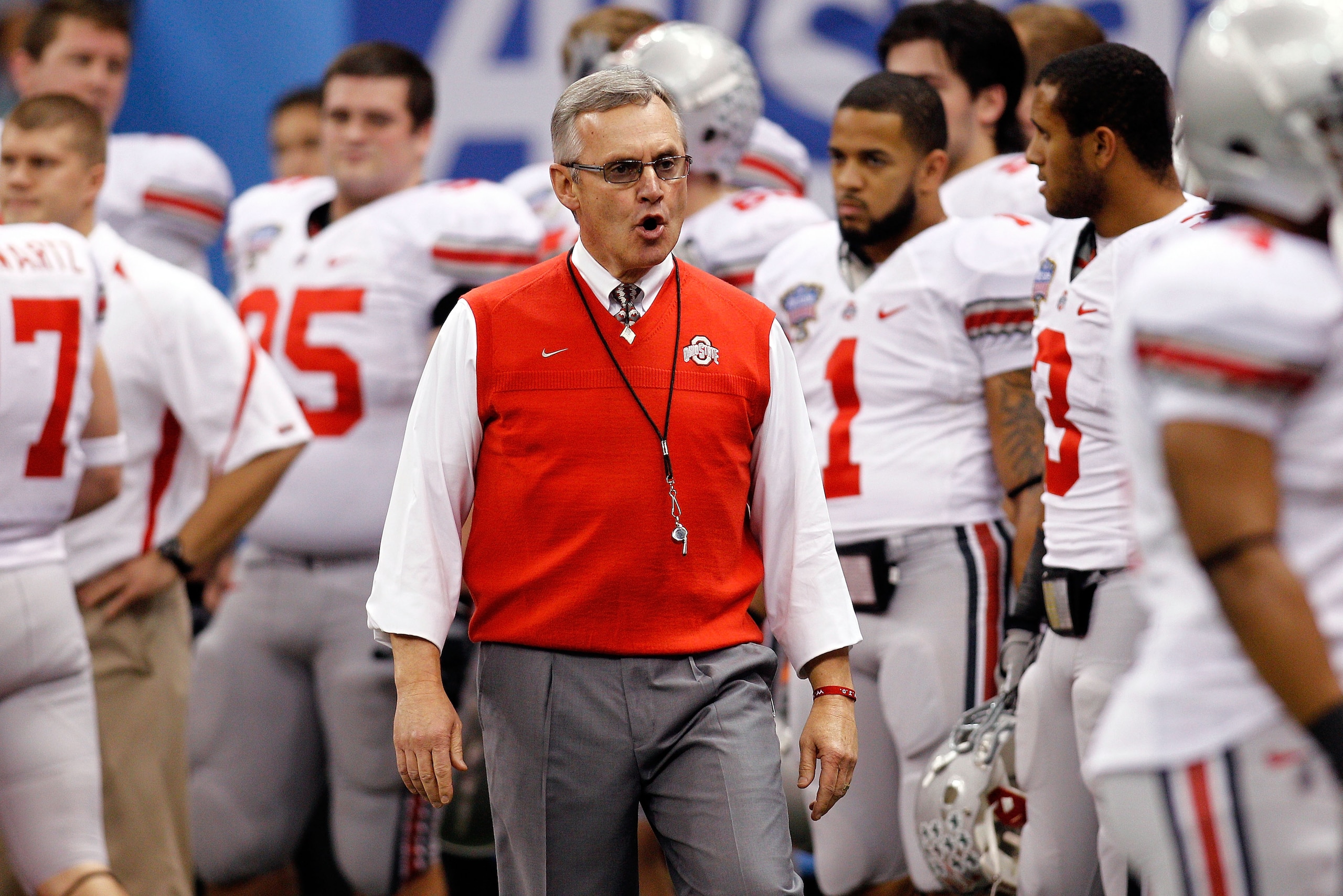 NEW ORLEANS, LA - JANUARY 04:  Head coach Jim Tressel of the Ohio State Buckeyes gathers his team before the Allstate Sugar Bowl against the Arkansas Razorbacks at the Louisiana Superdome on January 4, 2011 in New Orleans, Louisiana.  (Photo by Chris Gray