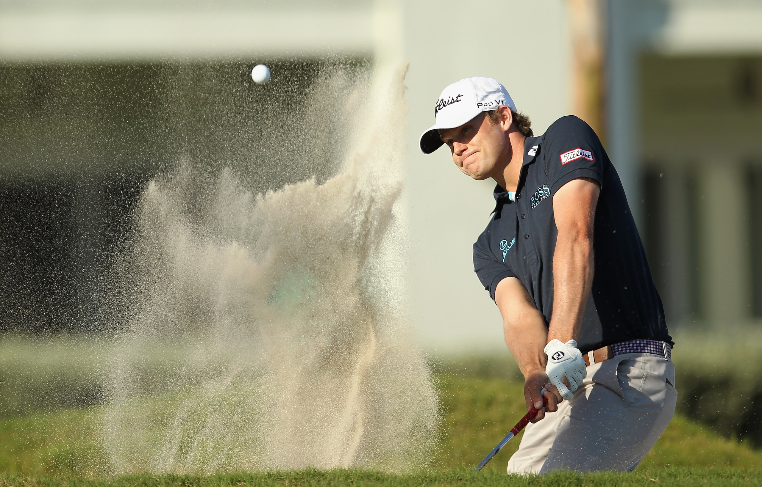 DORAL, FL - MARCH 13:  Nick Watney hits a bunker shot on the 13th hole during the final round of the 2011 WGC- Cadillac Championship at the TPC Blue Monster at the Doral Golf Resort and Spa on March 13, 2011 in Doral, Florida.  (Photo by Mike Ehrmann/Gett