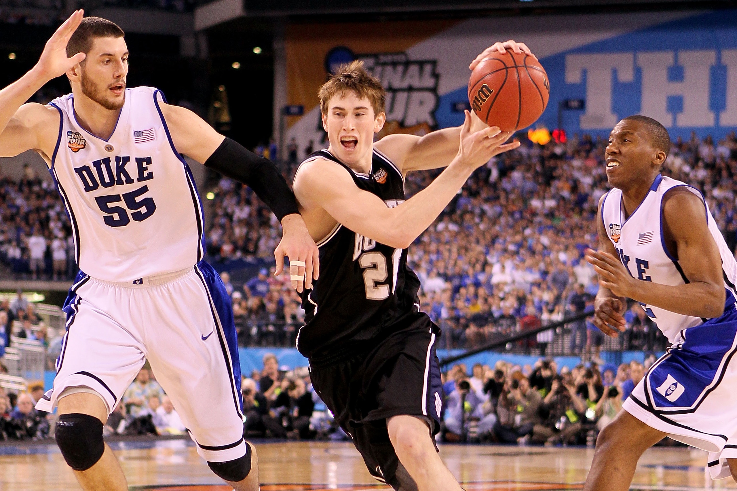 INDIANAPOLIS - APRIL 05:  Gordon Hayward #20 of the Butler Bulldogs drives on Brian Zoubek #55 and Nolan Smith #2 of the Duke Blue Devils in the second half during the 2010 NCAA Division I Men's Basketball National Championship game at Lucas Oil Stadium o