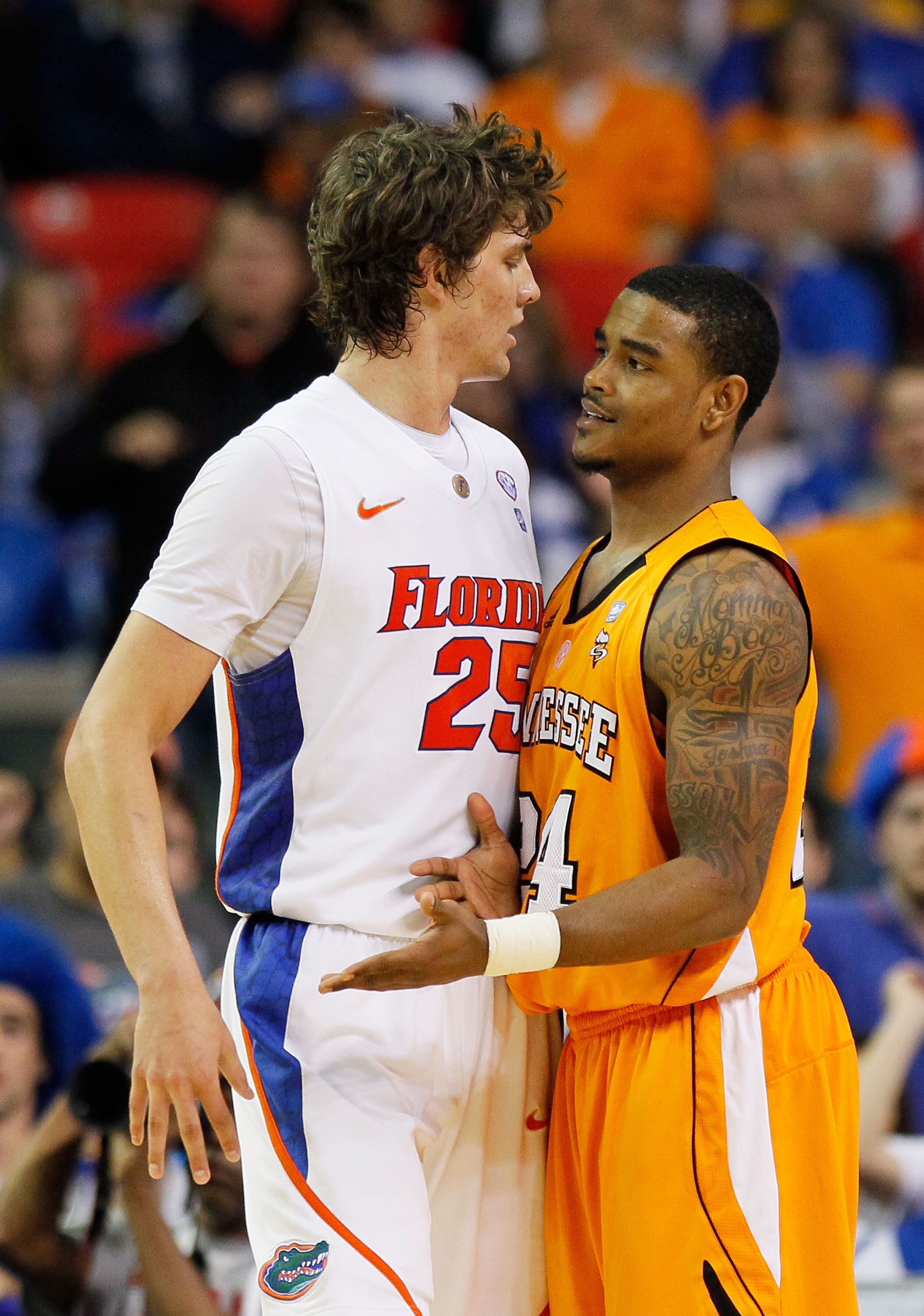 ATLANTA, GA - MARCH 11:  Josh Bone #24 of the Tennessee Volunteers and Chandler Parsons #25 of the Florida Gators interact during the quarterfinals of the SEC Men's Basketball Tournament at Georgia Dome on March 11, 2011 in Atlanta, Georgia.  (Photo by Ke