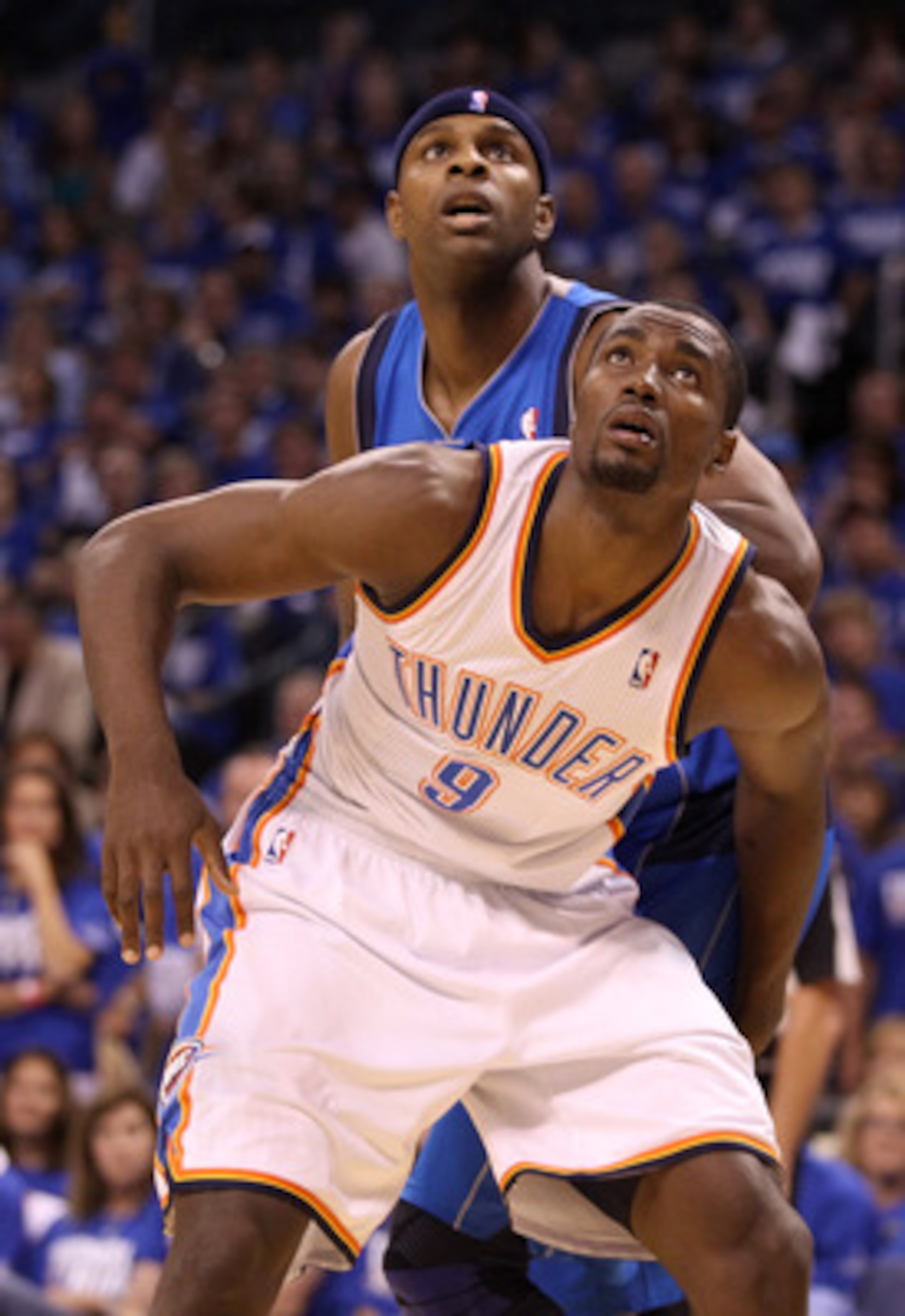 OKLAHOMA CITY, OK - MAY 21:  Serge Ibaka #9 of the Oklahoma City Thunder boxes out Brendan Haywood #33 of the Dallas Mavericks in the first half in Game Three of the Western Conference Finals during the 2011 NBA Playoffs at Oklahoma City Arena on May 21,