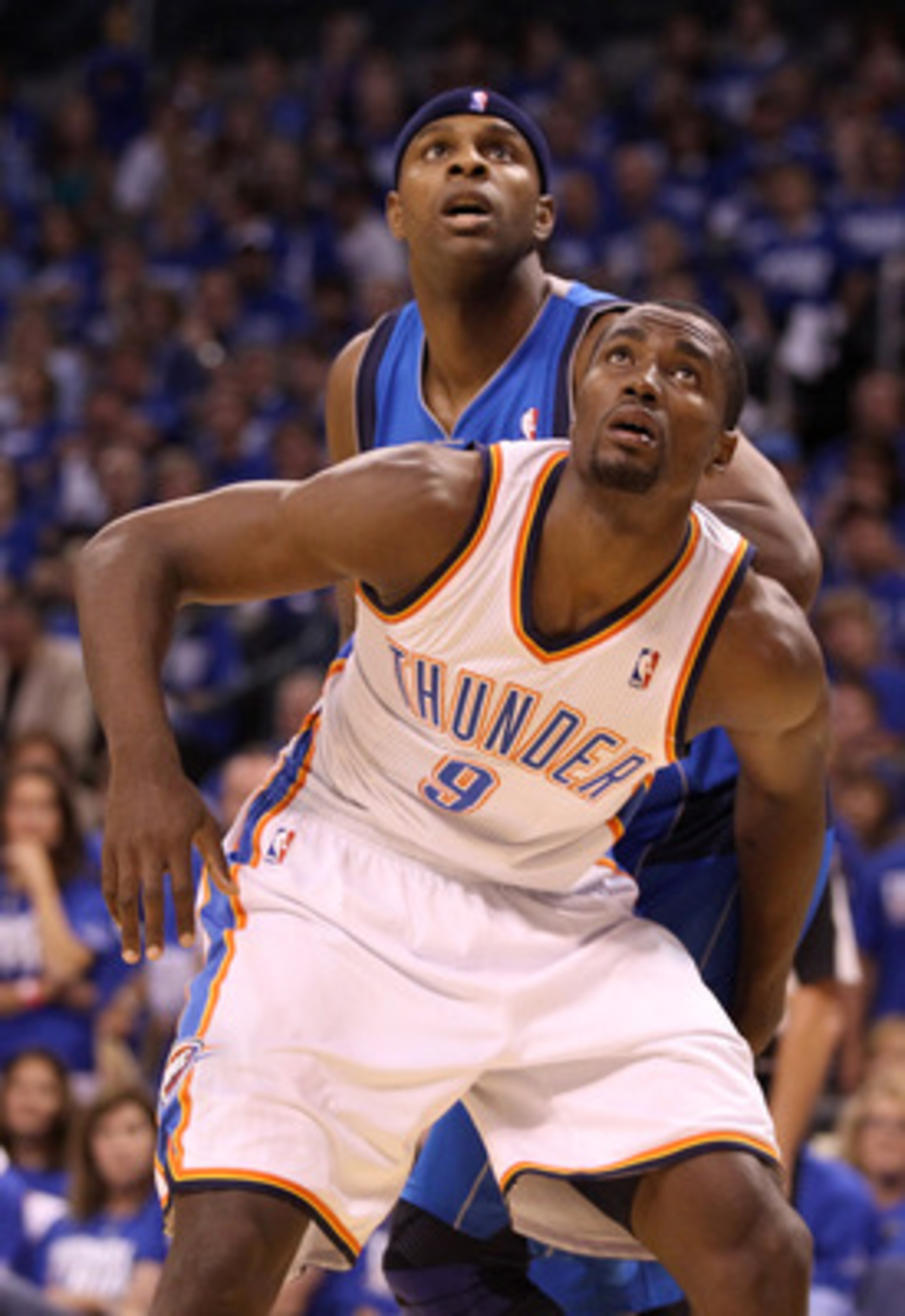 OKLAHOMA CITY, OK - MAY 21:  Serge Ibaka #9 of the Oklahoma City Thunder boxes out Brendan Haywood #33 of the Dallas Mavericks in the first half in Game Three of the Western Conference Finals during the 2011 NBA Playoffs at Oklahoma City Arena on May 21,