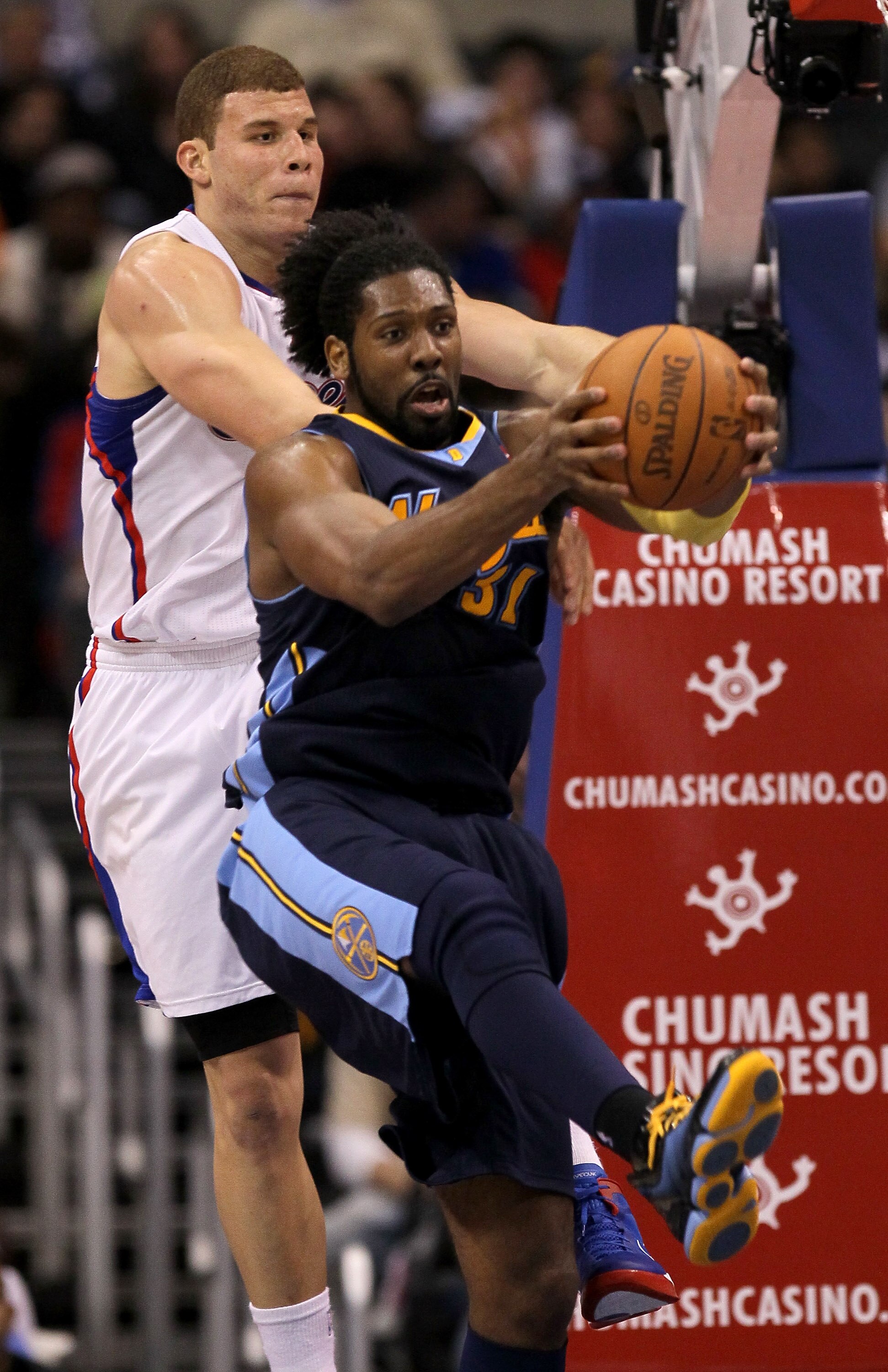 LOS ANGELES, CA - MARCH 05:  Nene #31 of the Denver Nuggets grabs a rebound from Blake Griffin #32 of the Los Angeles Clippers at Staples Center on March 5, 2011 in Los Angeles, California. The Clippers won 100-94. NOTE TO USER: User expressly acknowledge