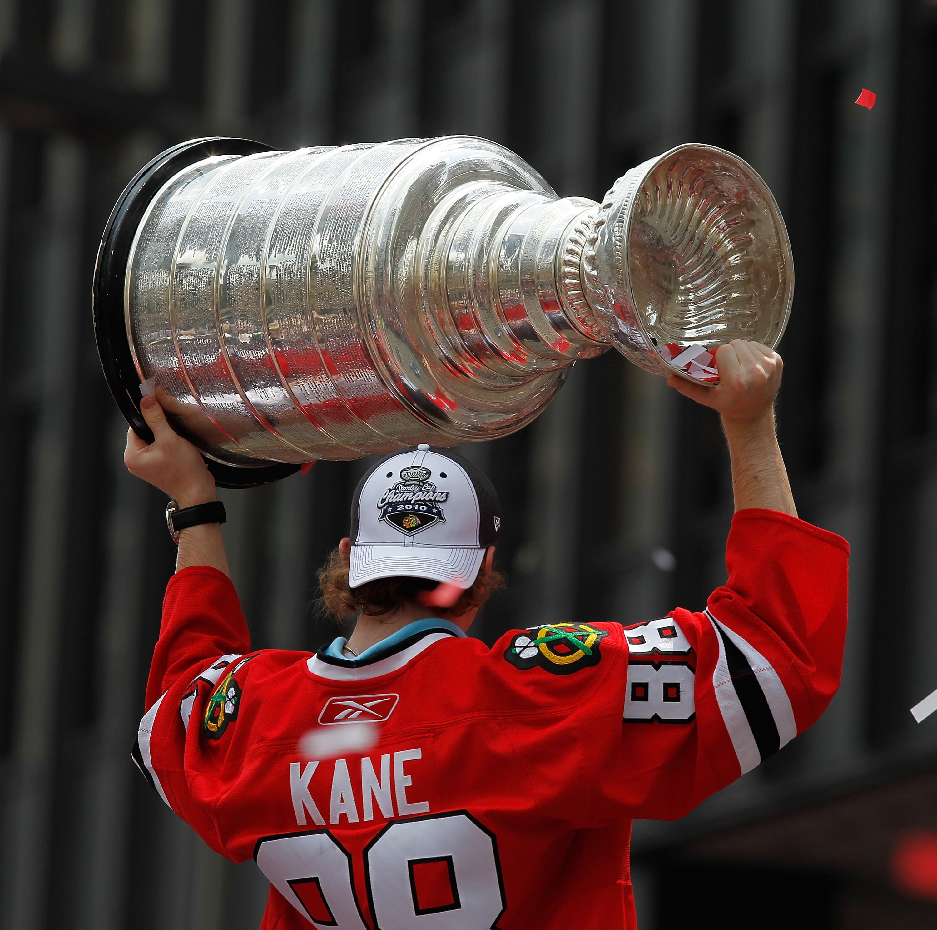 CHICAGO - JUNE 11: Patrick Kane #88 hoists the cup during the Chicago Blackhawks Stanley Cup victory parade and rally on June 11, 2010 in Chicago, Illinois. (Photo by Jonathan Daniel/Getty Images)