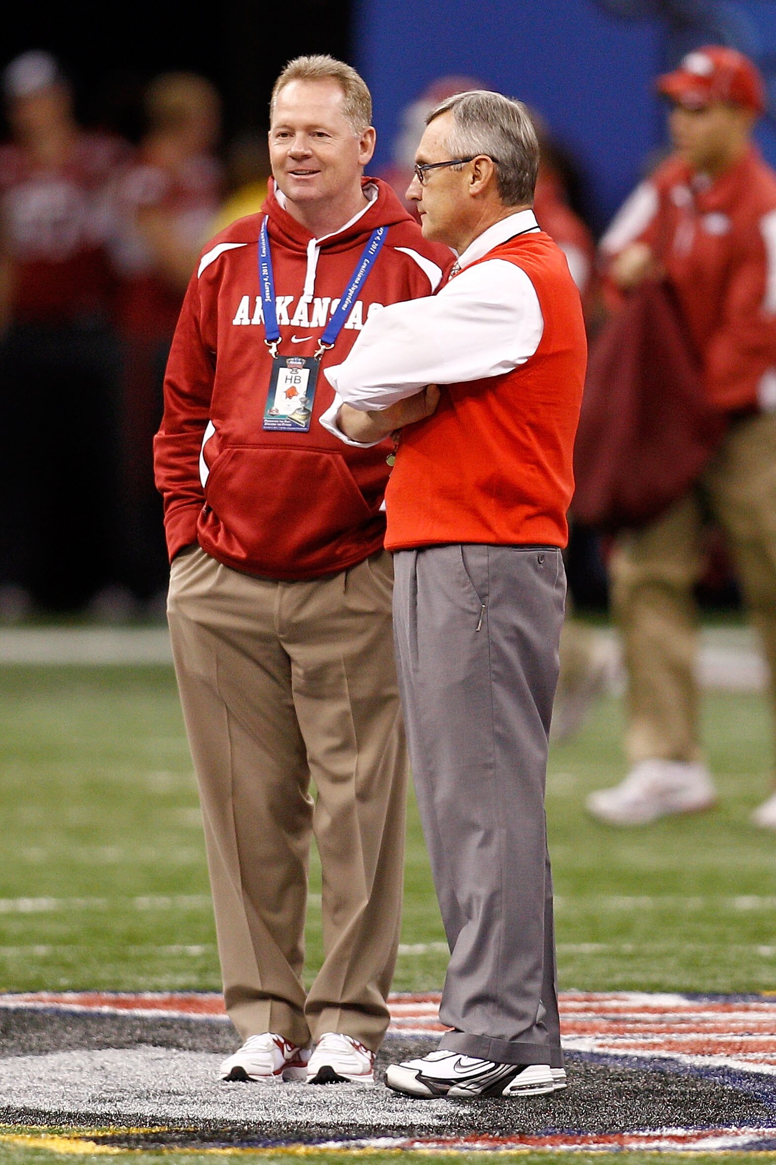 NEW ORLEANS, LA - JANUARY 04:  (L-R) Head coach Bobby Petrino of the Arkansas Razorbacks talks with head coach Jim Tressel of the Ohio State Buckeyes before the Allstate Sugar Bowl at the Louisiana Superdome on January 4, 2011 in New Orleans, Louisiana.
