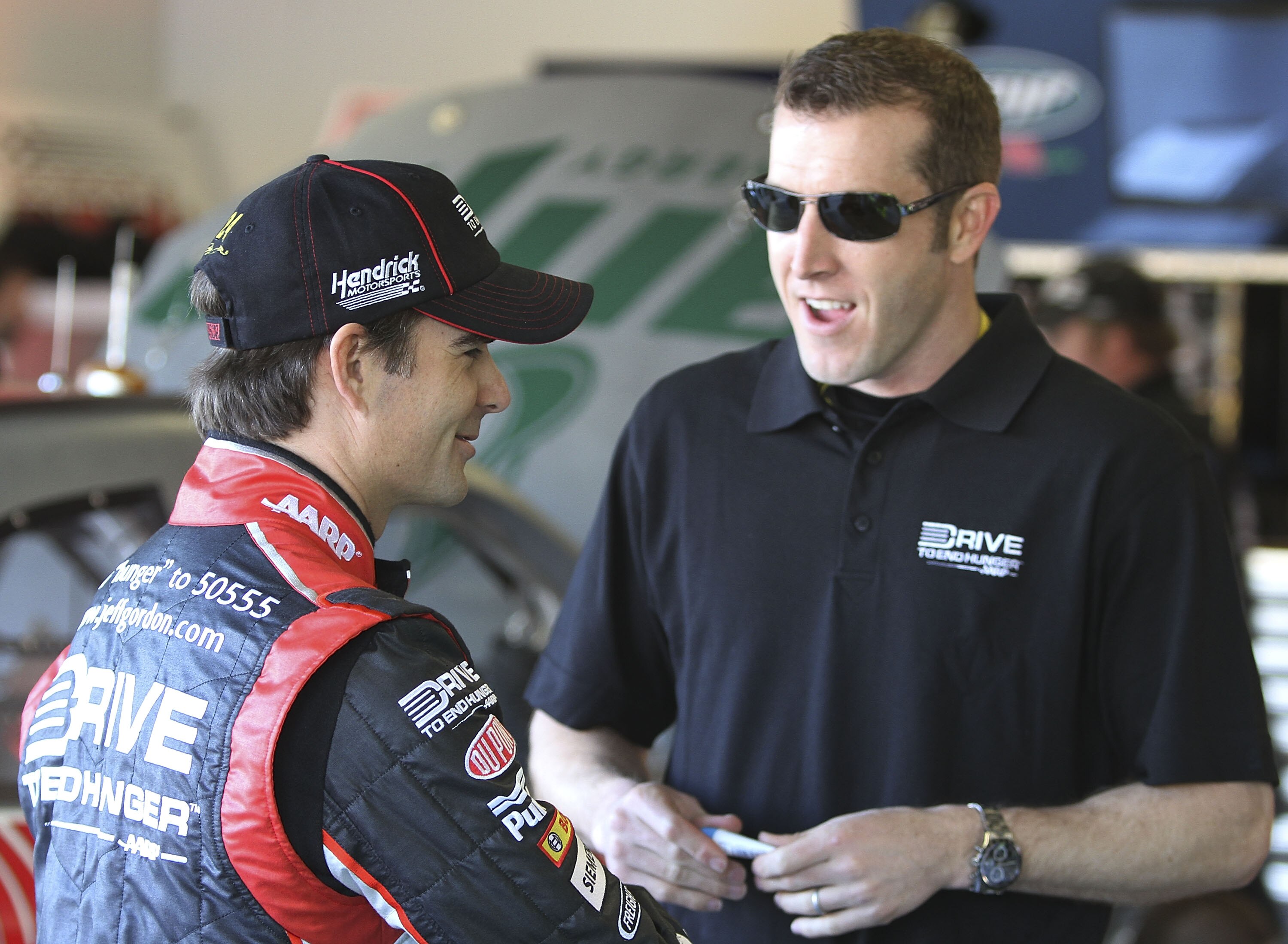 DAYTONA BEACH, FL - JANUARY 20:  Jeff Gordon, driver of the #24 Dupont Chevrolet talks with crew chief Alan Gustafson during testing at Daytona International Speedway on January 20, 2011 in Daytona Beach, Florida.  (Photo by Jerry Markland/Getty Images fo