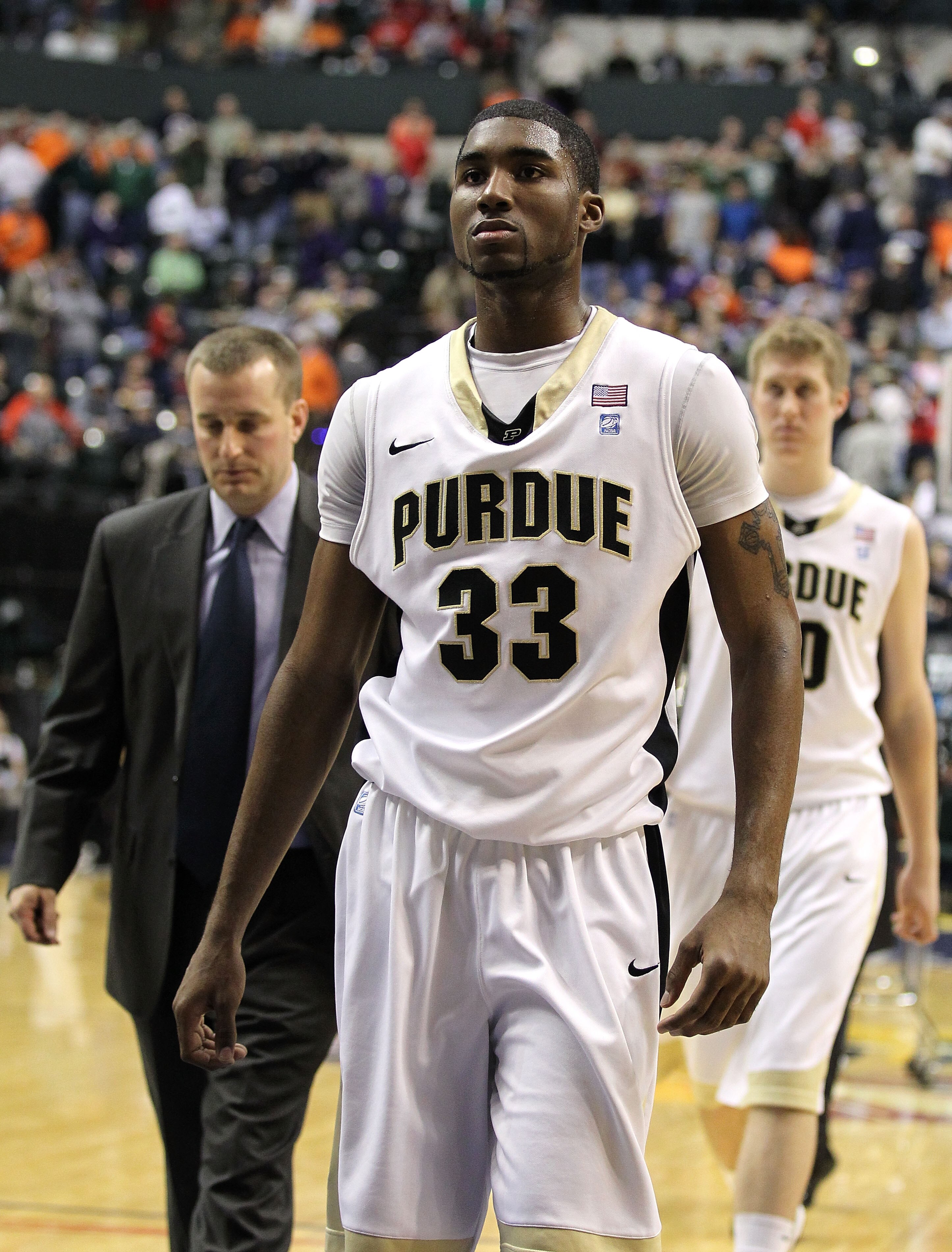 INDIANAPOLIS, IN - MARCH 11:  E'Twaun Moore #33 of the Purdue Boilermakers  walks off the court dejected after they lost 74-56 against the Michigan State Spartans during the quarterfinals of the 2011 Big Ten Men's Basketball Tournament at Conseco Fieldhou