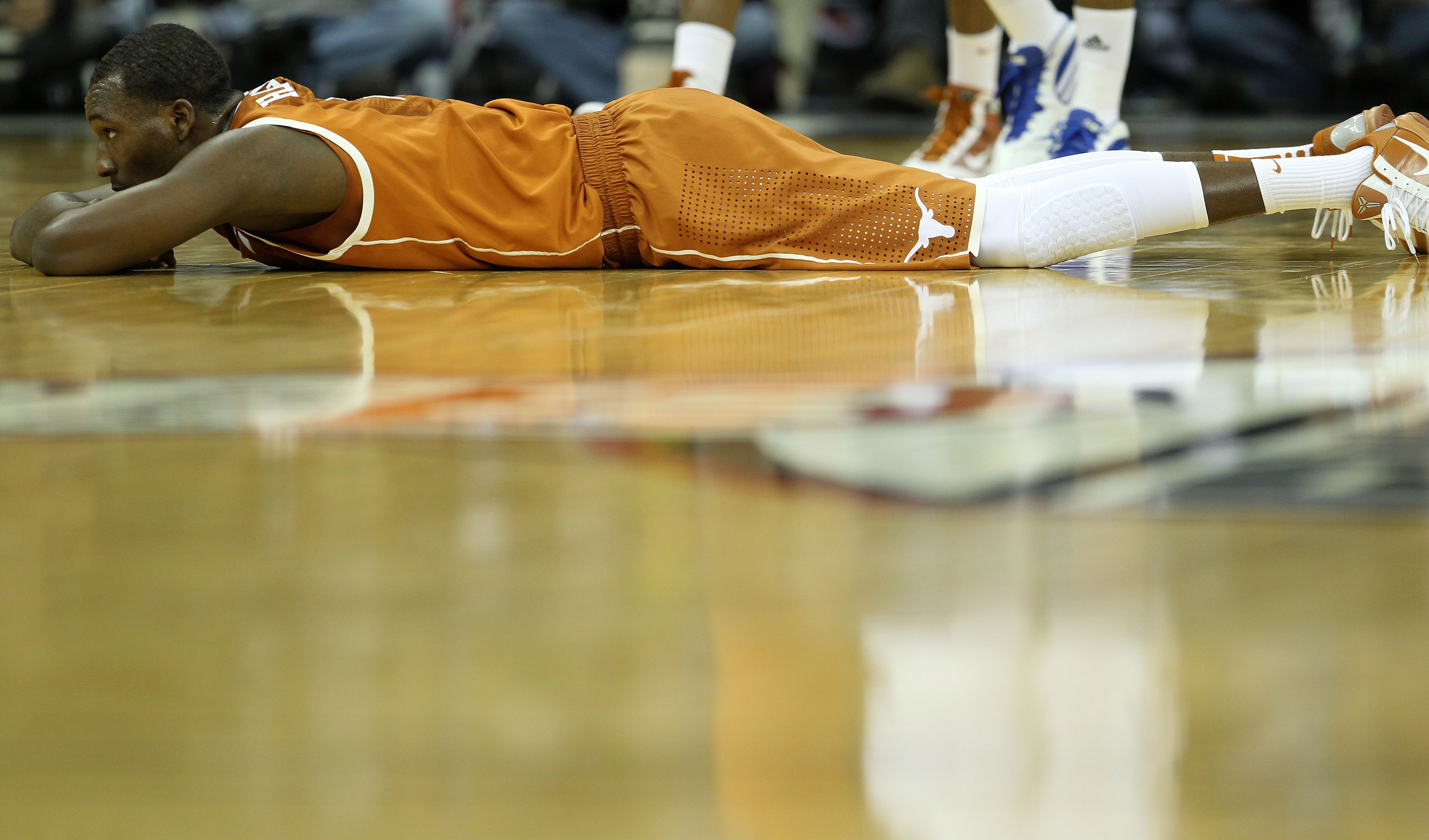 KANSAS CITY, MO - MARCH 12:  Jordan Hamilton #3 of the Texas Longhorns lays on the court after a play against the Kansas Jayhawks during the 2011 Phillips 66 Big 12 Men's Basketball Tournament championship game at Sprint Center on March 12, 2011 in Kansas