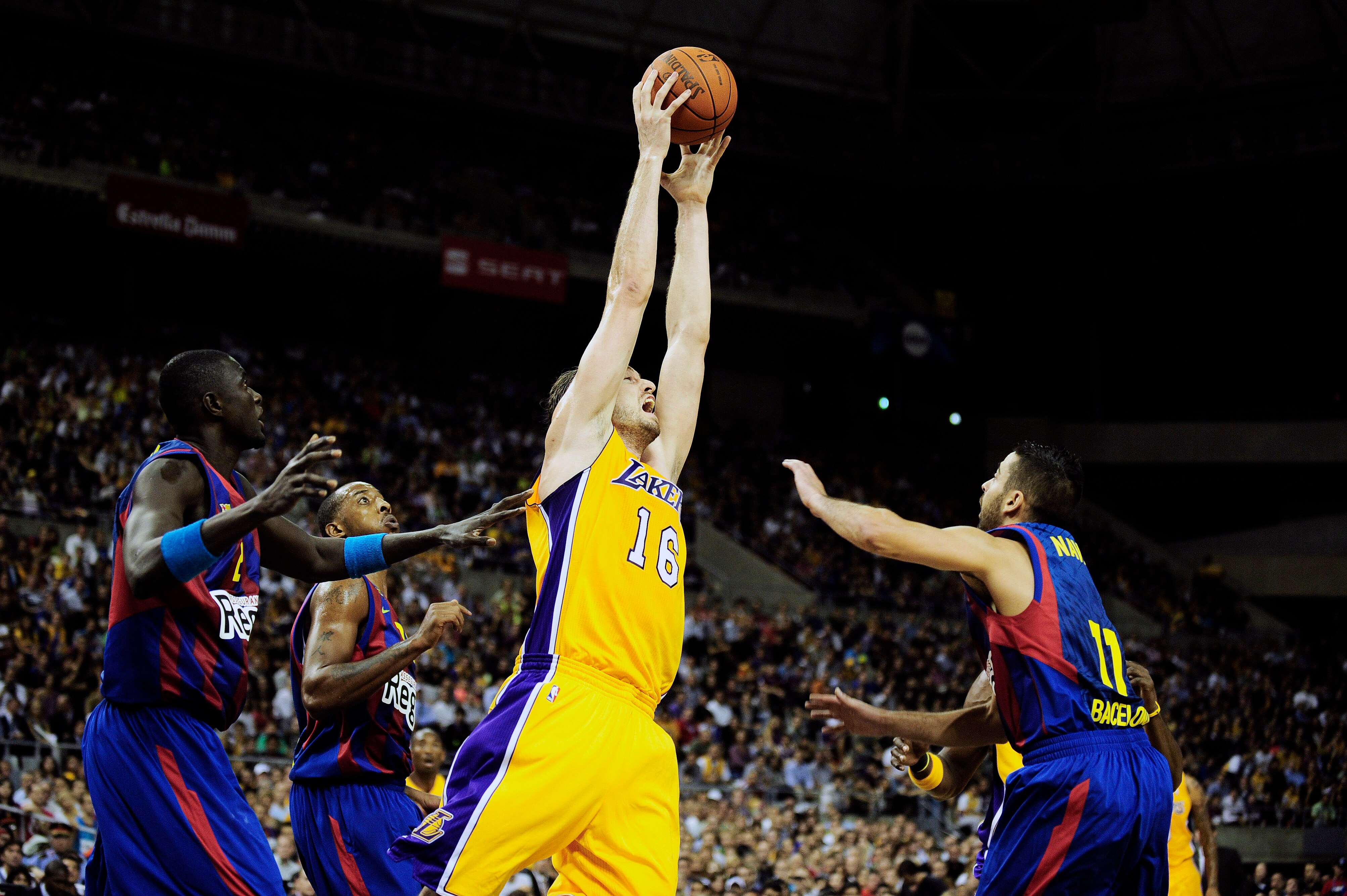 BARCELONA, SPAIN - OCTOBER 07:  Pau Gasol #16 of the Los Angeles Lakers (3rdL) fights for a rebound against Boniface Ndong #21 of the Regal FC Barcelona (L), Terence Morris #23 of the Regal FC Barcelona (2ndL) and Juan Carlos Navarro #11 of the Regal FC B