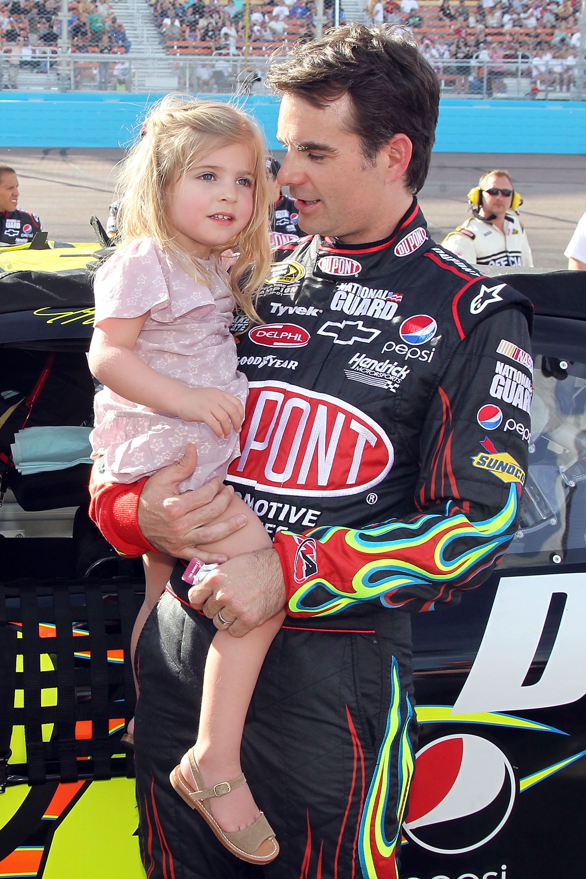 PHOENIX - APRIL 10:  Jeff Gordon, driver of the #24 DuPont Chevrolet, holds daughter Ella Sophia Gordon prior to the NASCAR Sprint Cup Series SUBWAY Fresh Fit 600 at Phoenix International Raceway on April 10, 2010 in Phoenix, Arizona.  (Photo by Christian