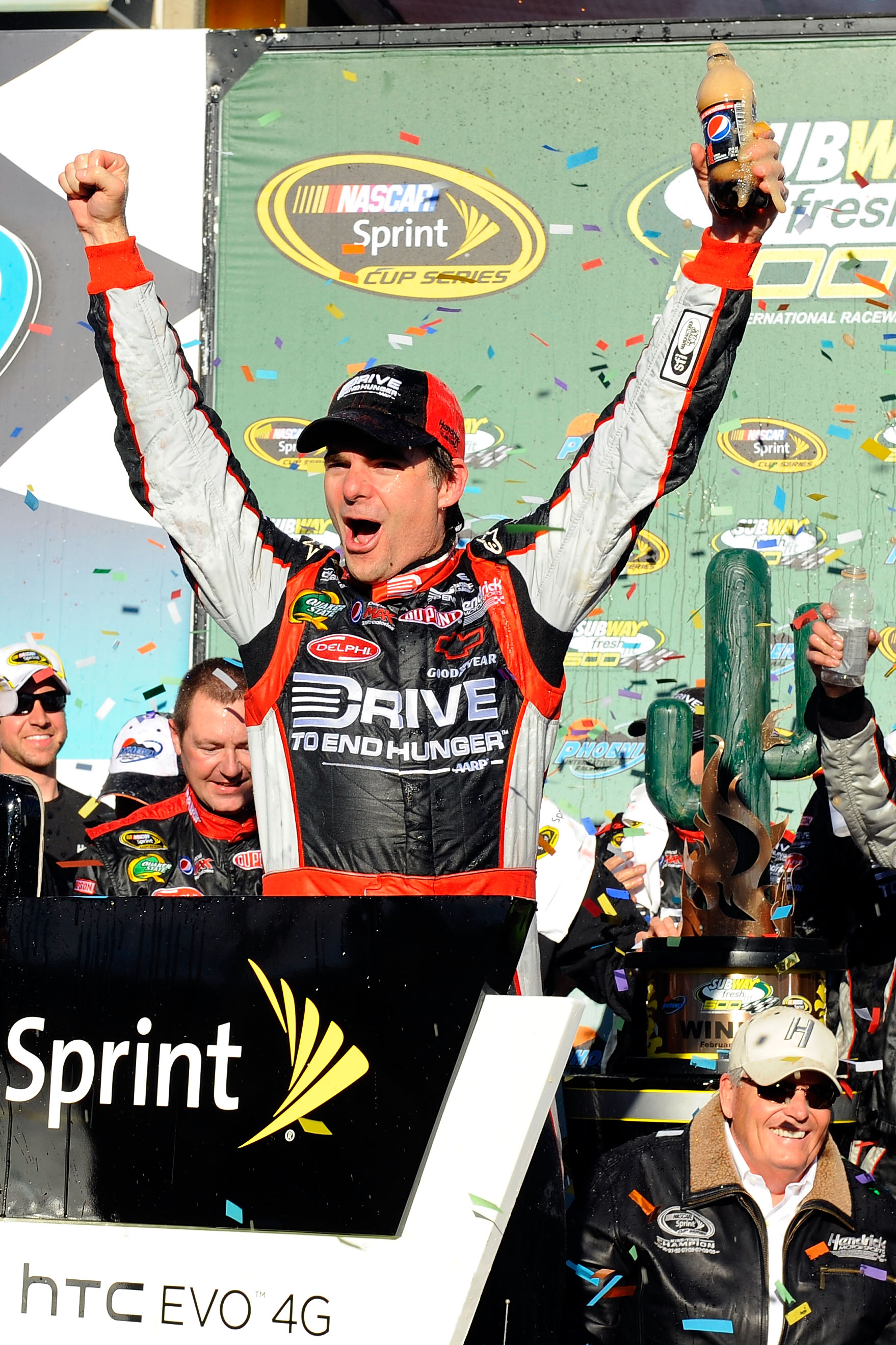 AVONDALE, AZ - FEBRUARY 27:  Jeff Gordon, driver of the #24 Drive to End Hunger Chevrolet, celebrates in victory lane after winning the NASCAR Sprint Cup Series Subway Fresh Fit 500 at Phoenix International Raceway on February 27, 2011 in Avondale, Arizon