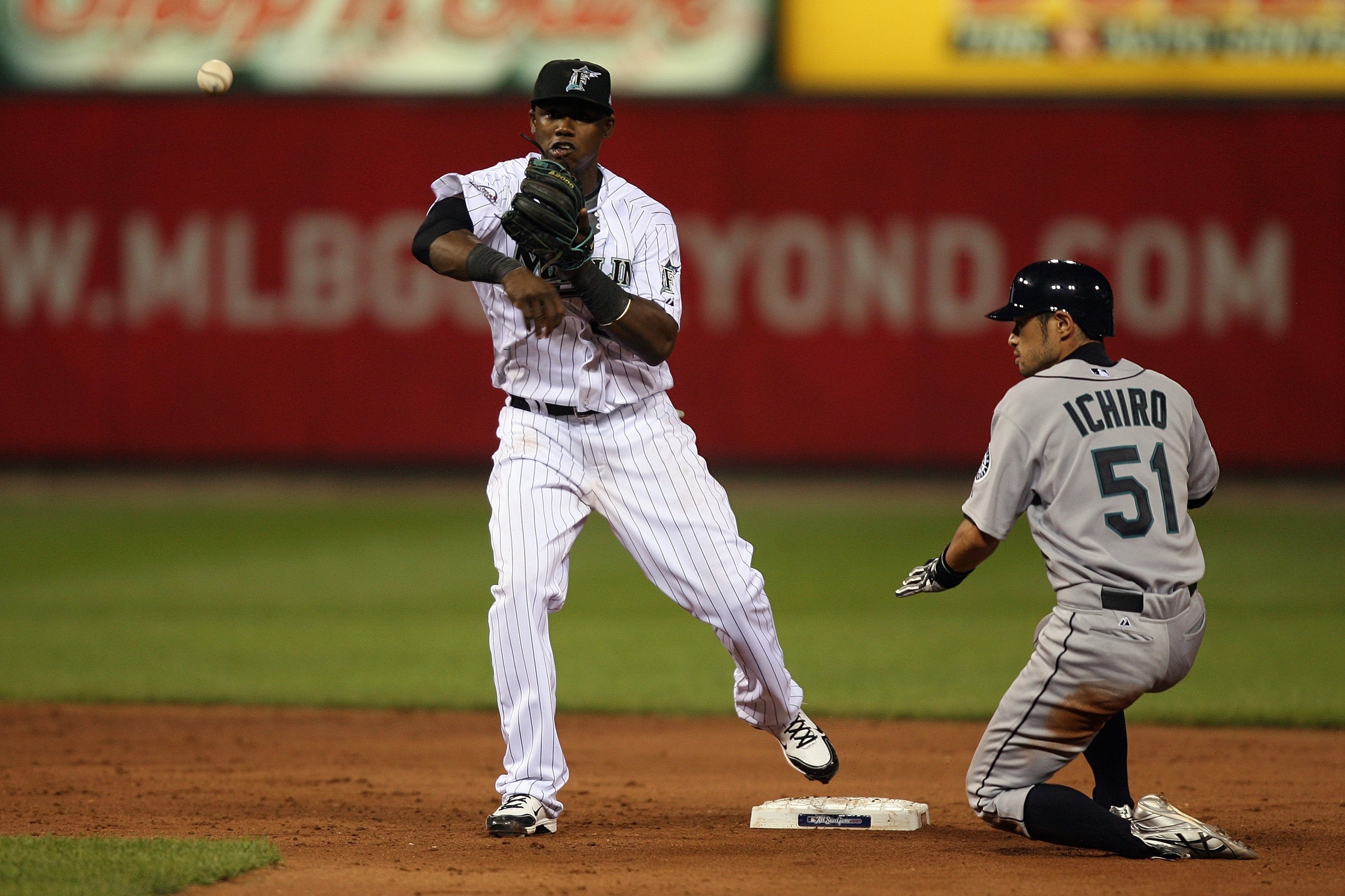ST. LOUIS, MO - JULY 14:  National League All-Star Hanley Ramirez of the Florida Marlins throws to first against American League All-Star Ichiro Suzuki of the Seattle Mariners during the 2009 MLB All-Star Game at Busch Stadium on July 14, 2009 in St Louis