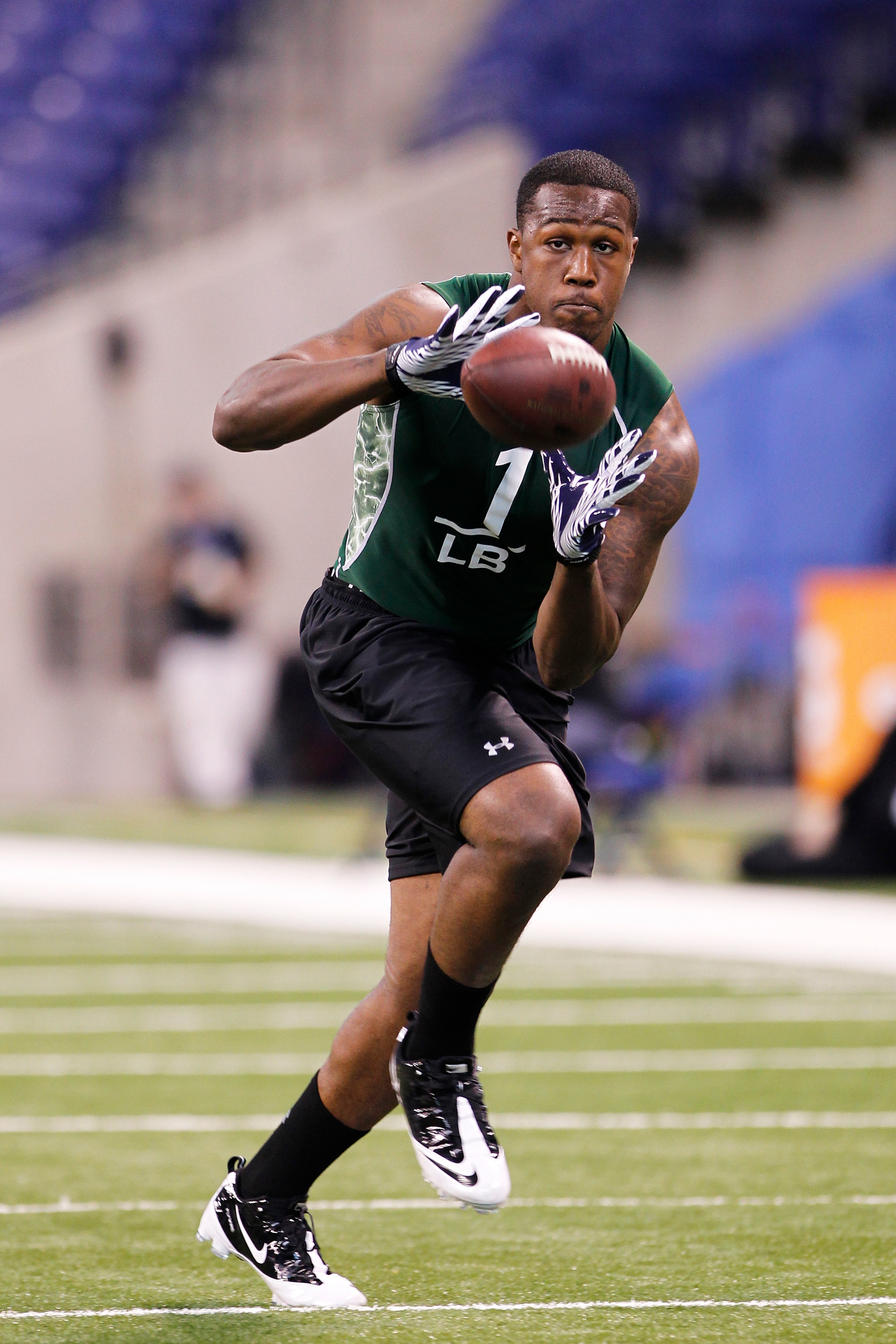 INDIANAPOLIS, IN - FEBRUARY 28: Akeem Ayers of UCLA works out during the 2011 NFL Scouting Combine at Lucas Oil Stadium on February 28, 2011 in Indianapolis, Indiana. (Photo by Joe Robbins/Getty Images)
