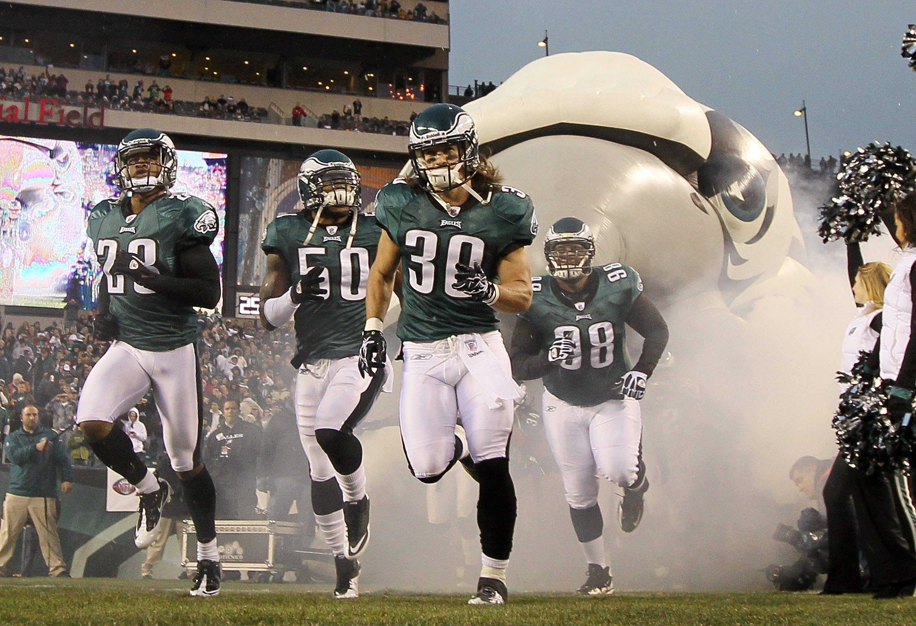 PHILADELPHIA, PA - JANUARY 02:  Dimitri Patterson #23, Sean Lee #50, Colt Anderson #30, and Mike Patterson #98 of the Philadelphia Eagles take the field to play against the Dallas Cowboys on January 2, 2011 at Lincoln Financial Field in Philadelphia, Penn