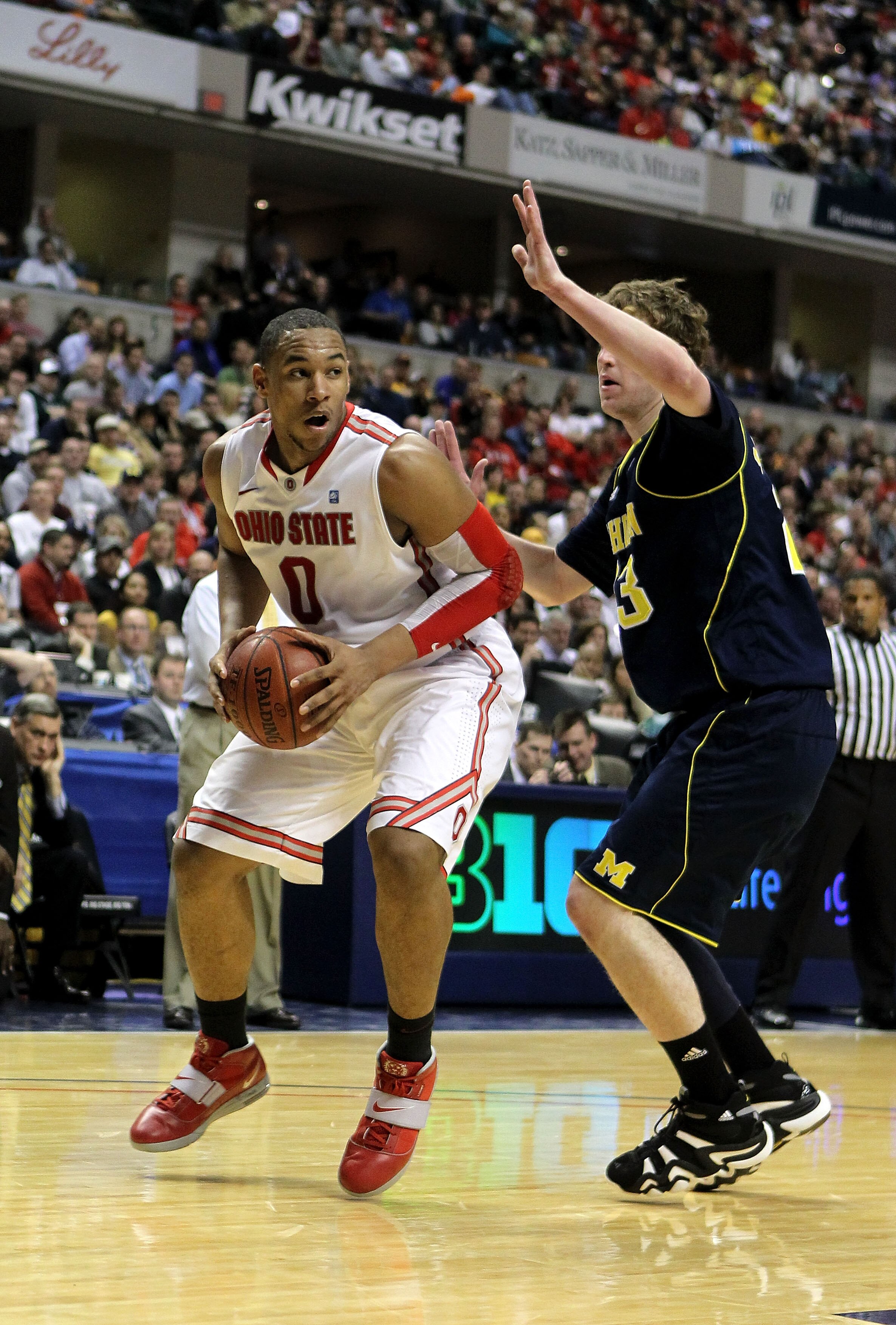 INDIANAPOLIS, IN - MARCH 12:  Jared Sullinger #0 of the Ohio State Buckeyes moves the ball inside against the Michigan Wolverines during the semifinals of the 2011 Big Ten Men's Basketball Tournament at Conseco Fieldhouse on March 12, 2011 in Indianapolis