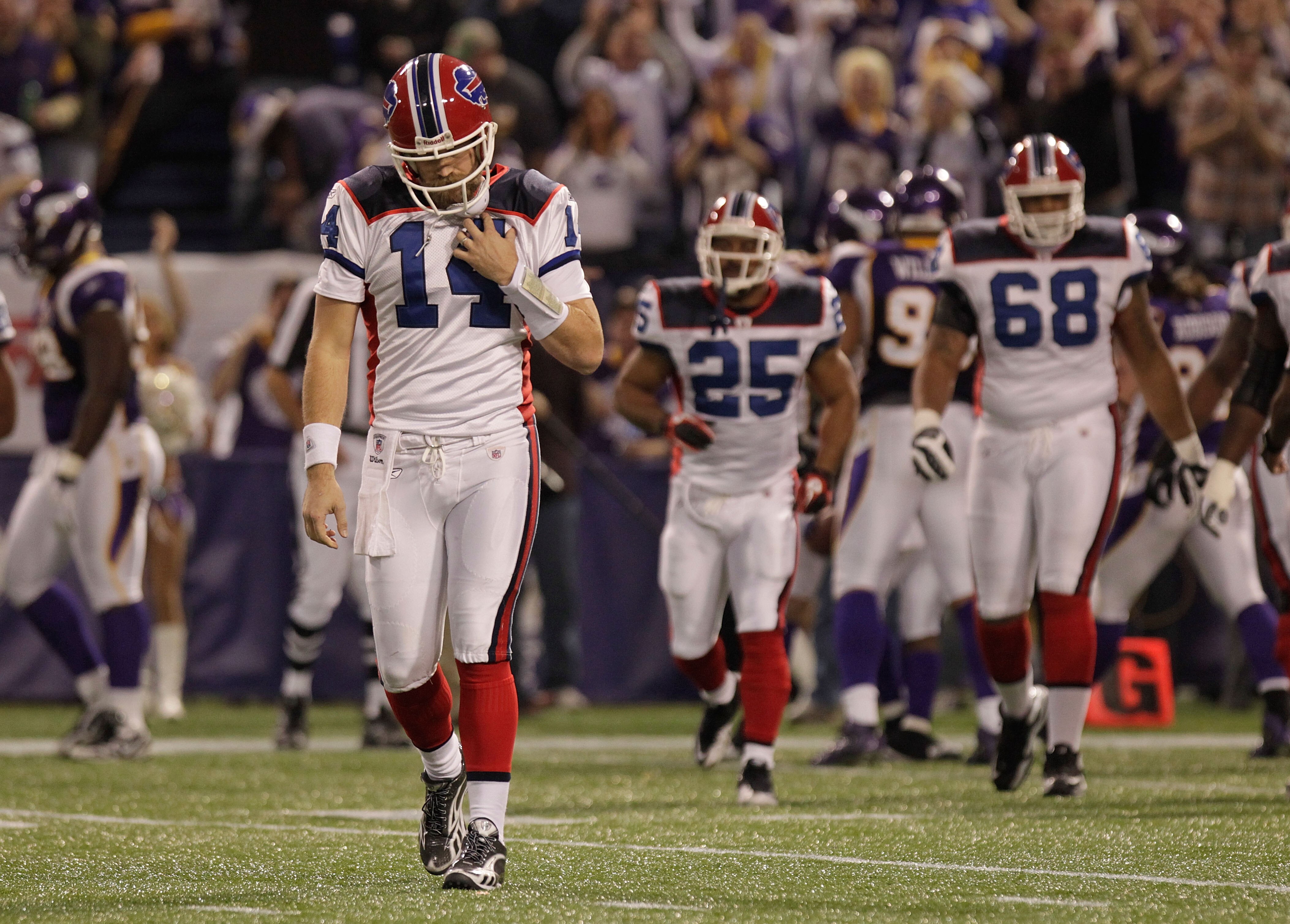 MINNEAPOLIS, MN - DECEMBER 05:  Ryan Fitzpatrick #14 of the Buffalo Bills walks from the field after throwing an interception against the Minnesota Vikings at the Mall of America Field at the Hubert H. Humphrey Metrodome on December 5, 2010 in Minneapolis