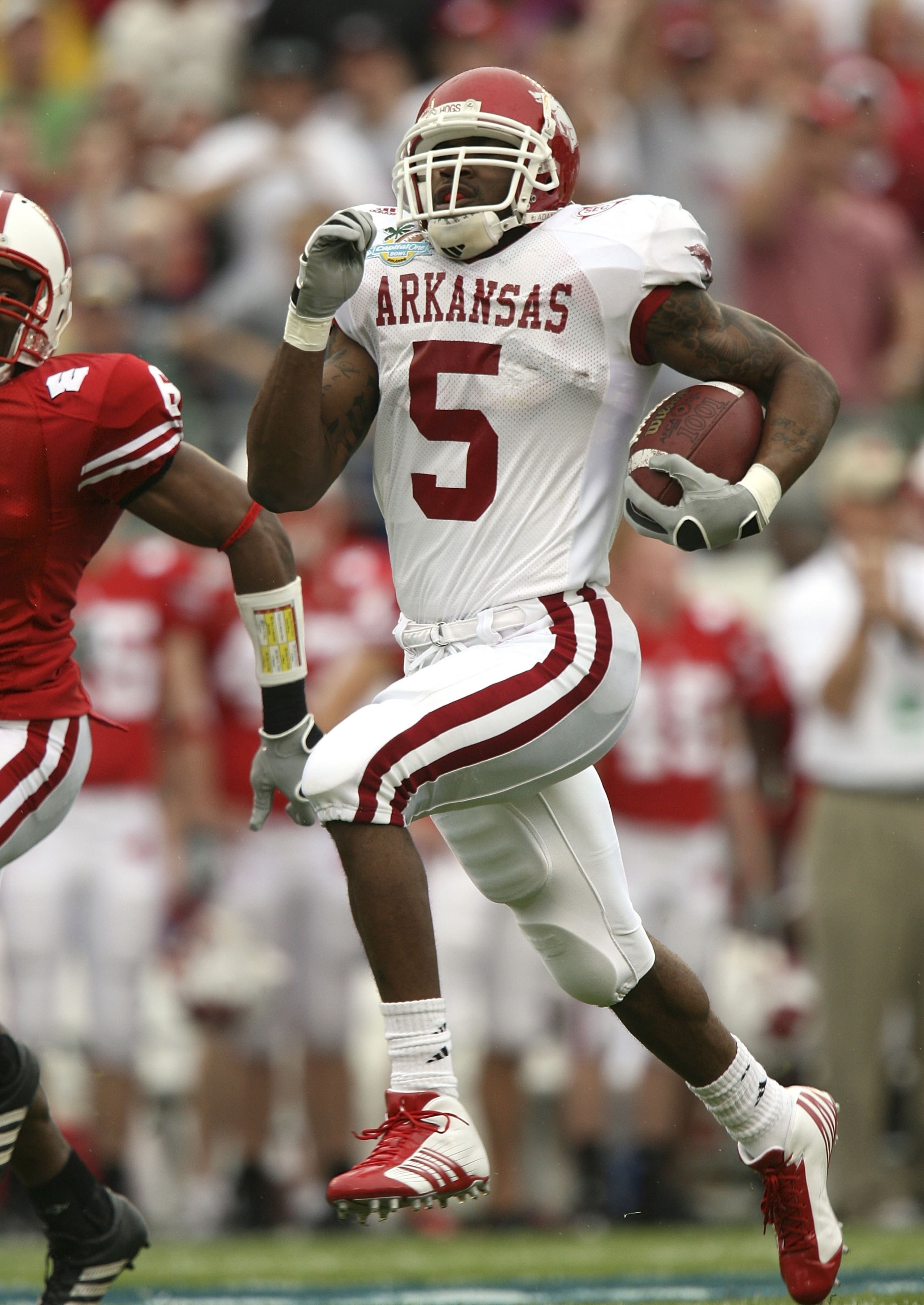 ORLANDO, FL - JANUARY 01:  Running back Darren McFadden #5 of the Arkansas Razorbacks runs for a long gain in the first quarter against the Wisconsin Badgers in the Capitol One Bowl at Florida Citrus Bowl on January 1, 2007 in Orlando, Florida.  (Photo by