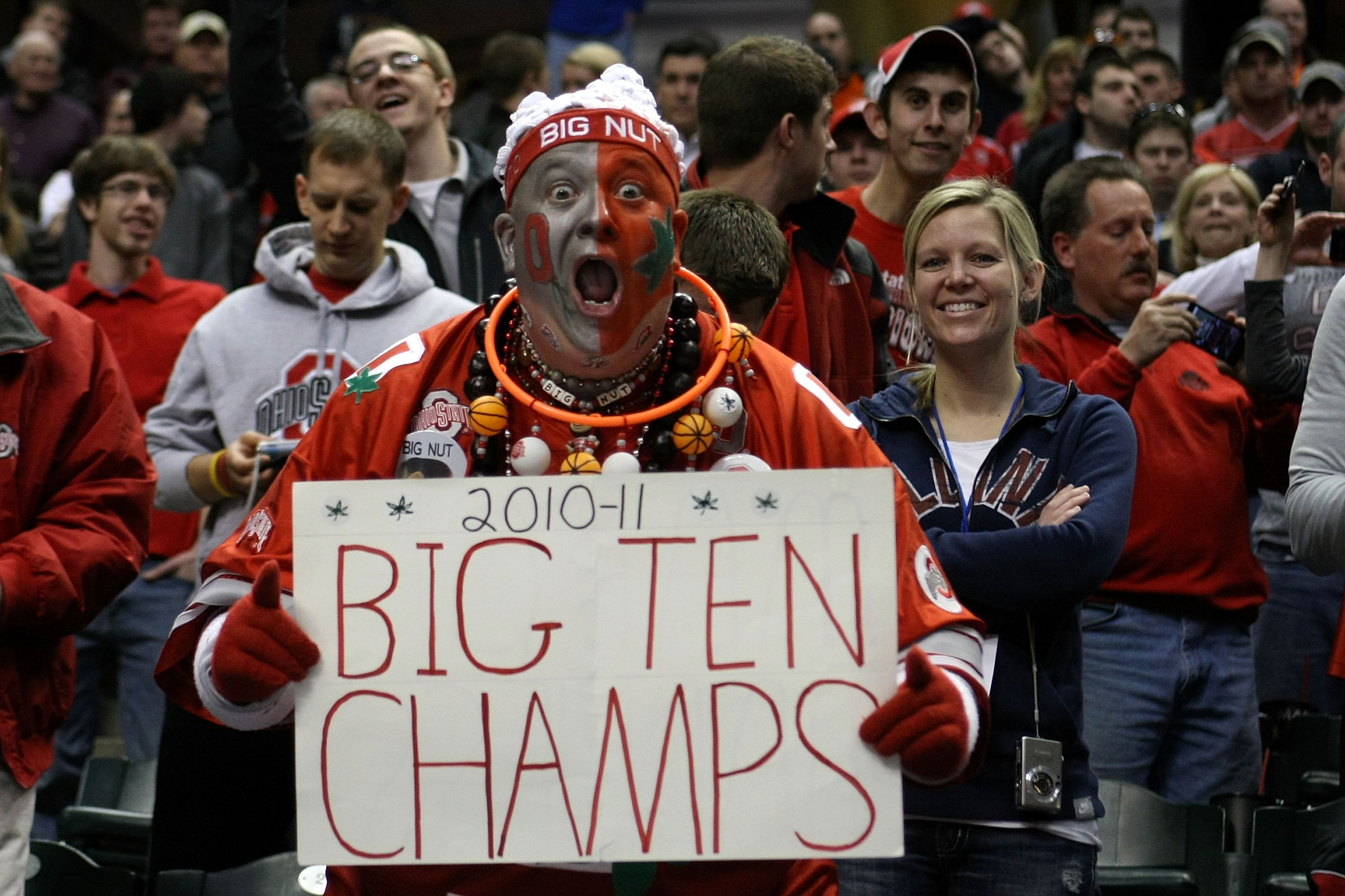 INDIANAPOLIS, IN - MARCH 13:  John 'Big Nut' Peters, fan of the Ohio State Buckeyes holds up a sign which reads '2010-11 Big Ten Champs' after they won 71-60 against the Penn State Nittany Lions during the championship game of the 2011 Big Ten Men's Baske