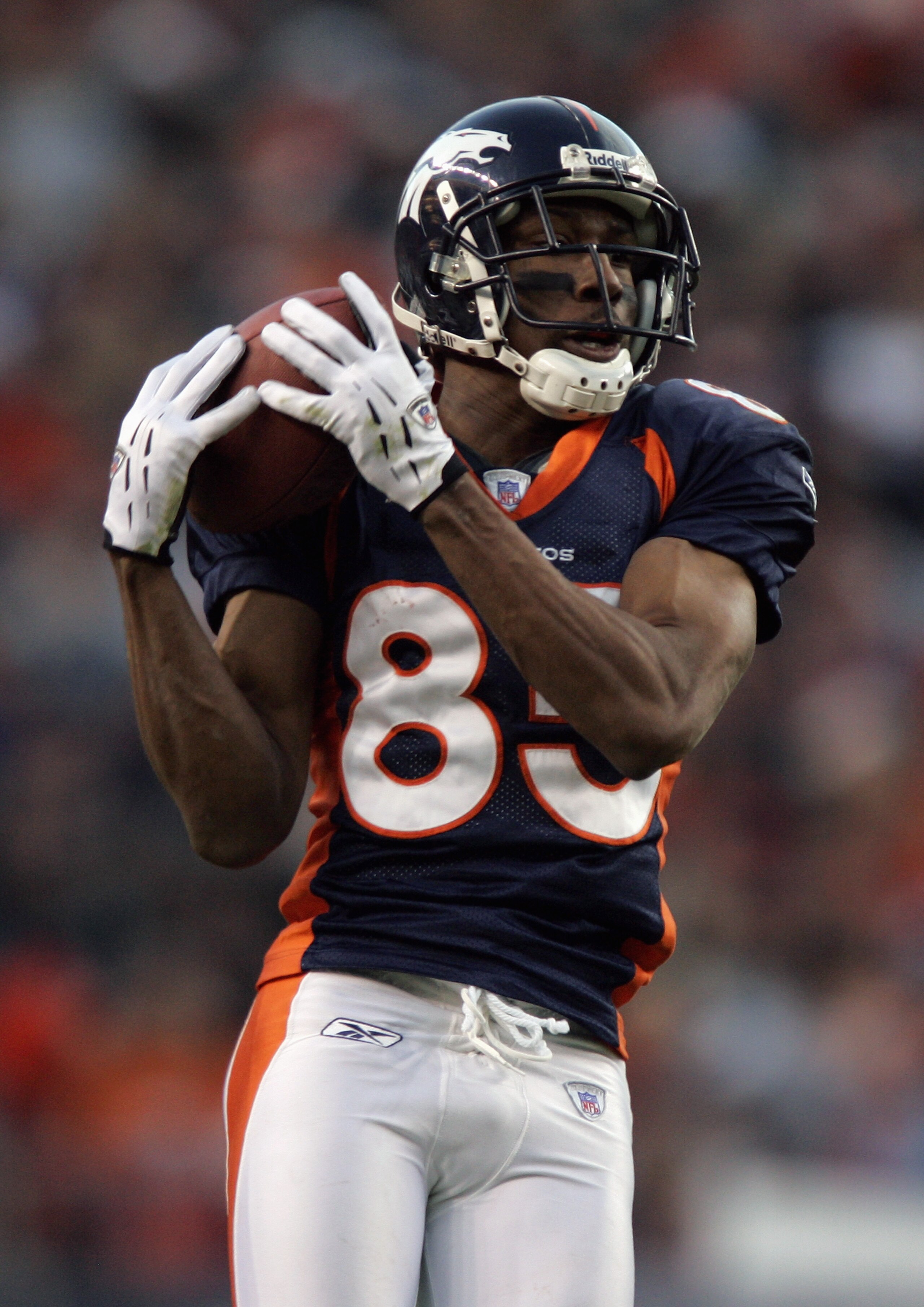 DENVER - DECEMBER 24:  Wide receiver Ashley Lelie #85 of the Denver Broncos hauls in a catch during the game against the Oakland Raiders on December 24, 2005 at Invesco Field at Mile High in Denver, Colorado.   The Broncos secured a bye week in the playof