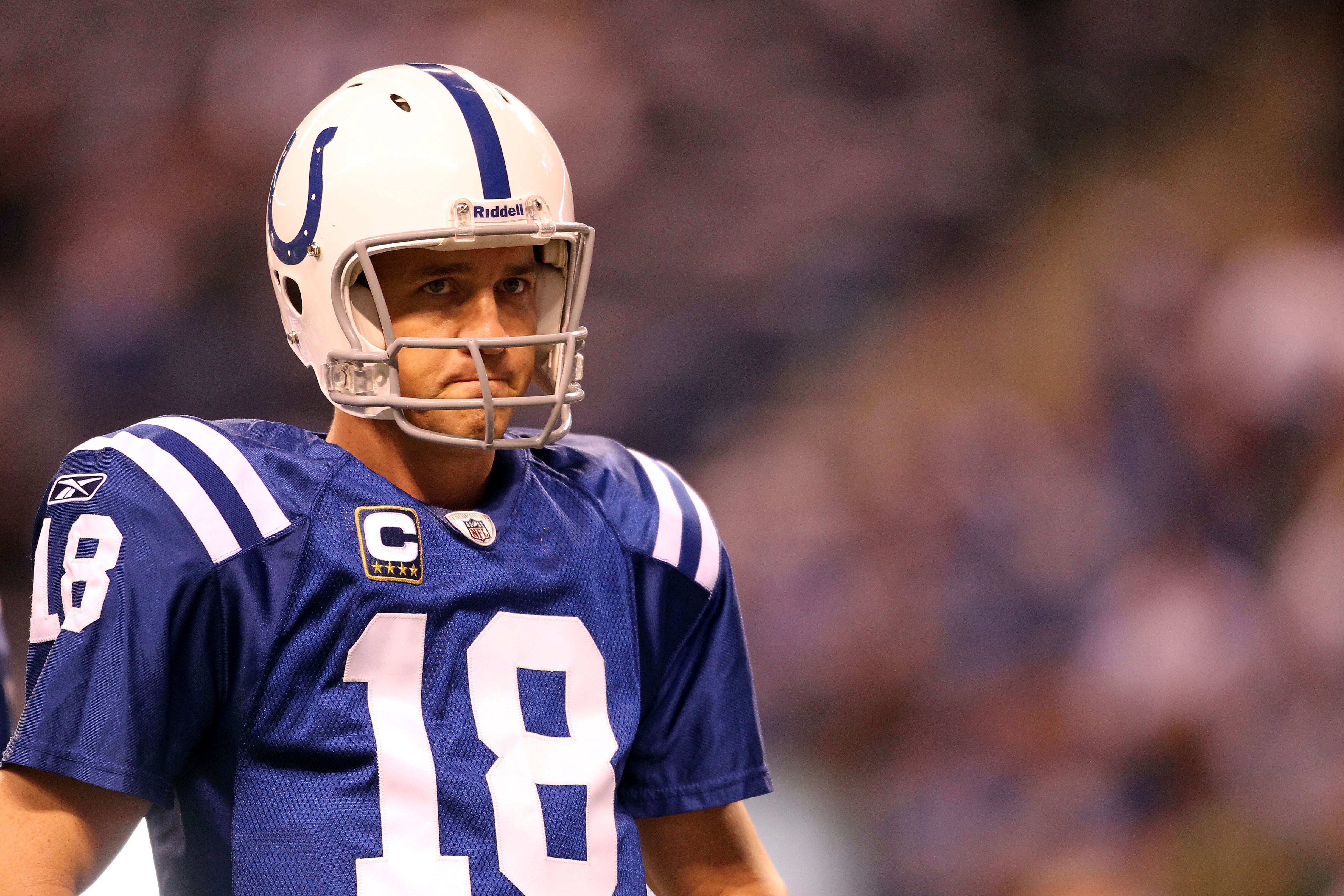 INDIANAPOLIS, IN - JANUARY 08:  Quarterback Peyton Manning #18 of the Indianapolis Colts looks on against the New York Jets during their 2011 AFC wild card playoff game at Lucas Oil Stadium on January 8, 2011 in Indianapolis, Indiana. The Jets won 17-16.