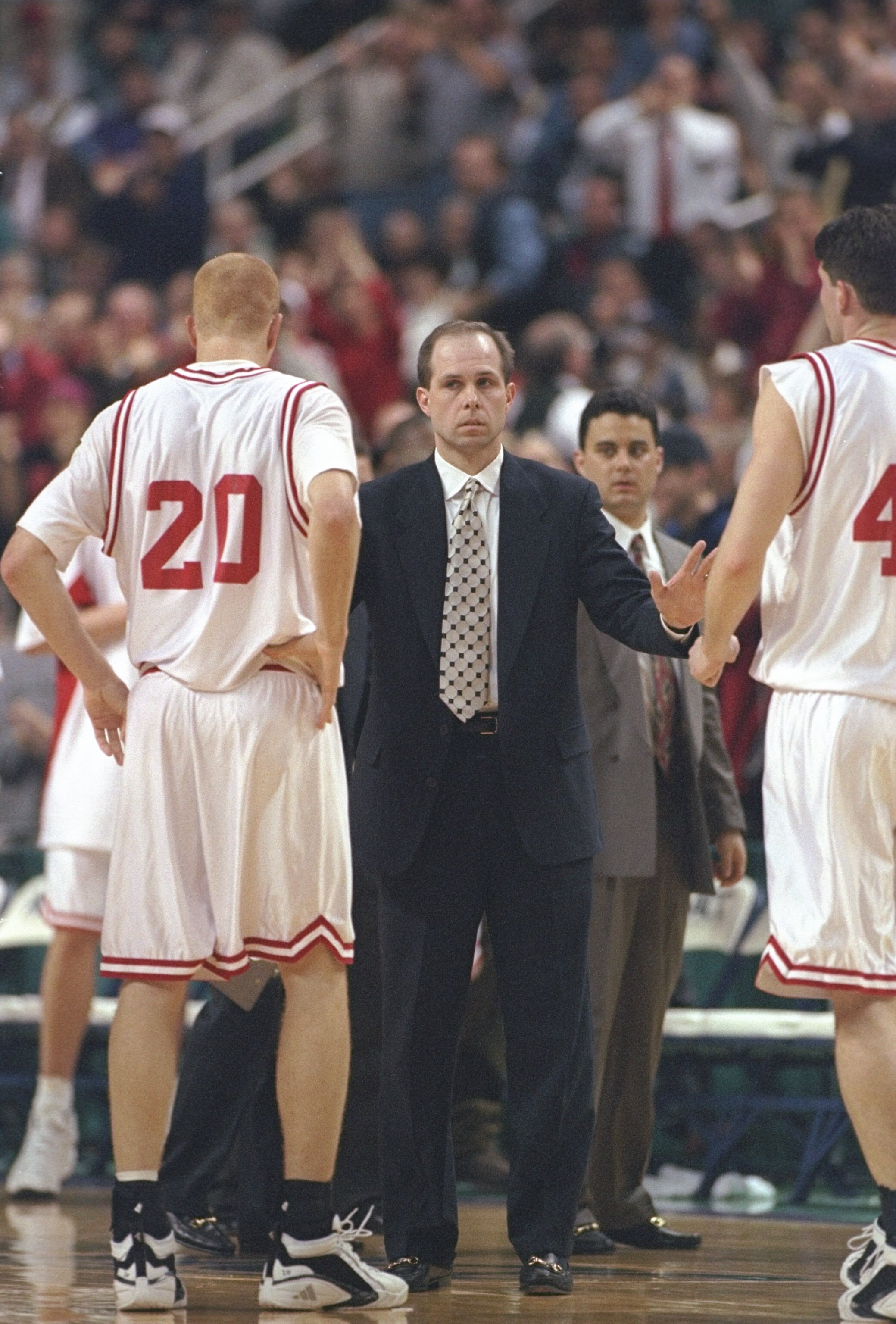 6 Mar 1997:  Coach Herb Sendek of the North Carolina State Wolfpack speaks with two of his players during a playoff game against the Georgia Tech Yellow Jackets at the Greensboro Coliseum in Greensboro, North Carolina.  North Carolina State won the game 6