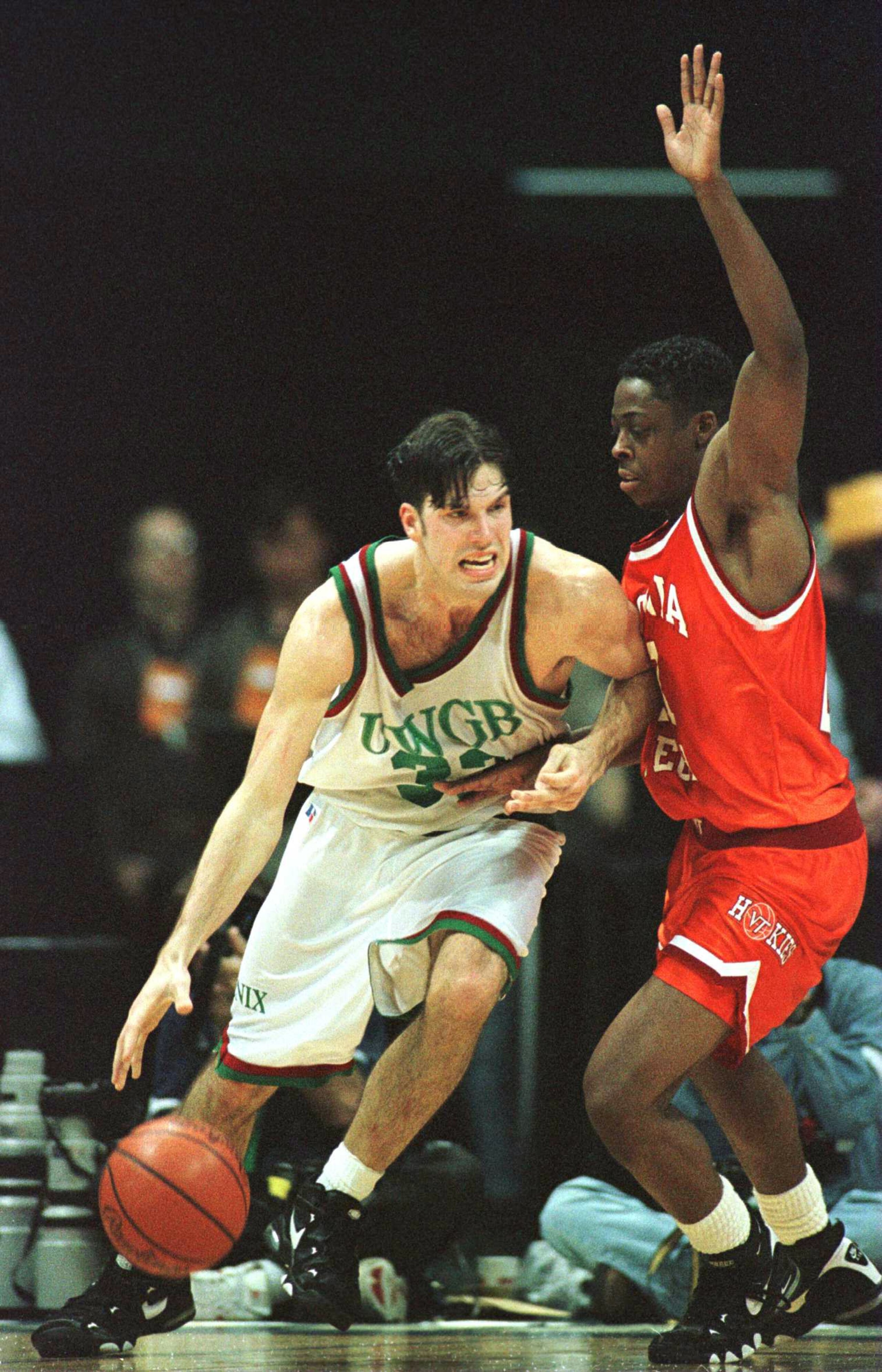 14 Mar 1996:  Jeff Nordgaard #33 of Wisconsin-Green Bay tries to drive around Shawn Good #21 of Virginia Tech in the second half of the Midwest Region NCAA Men''s Basketball Tournament first round game played at Renunion Arena in Dallas, Texas. Virginia T