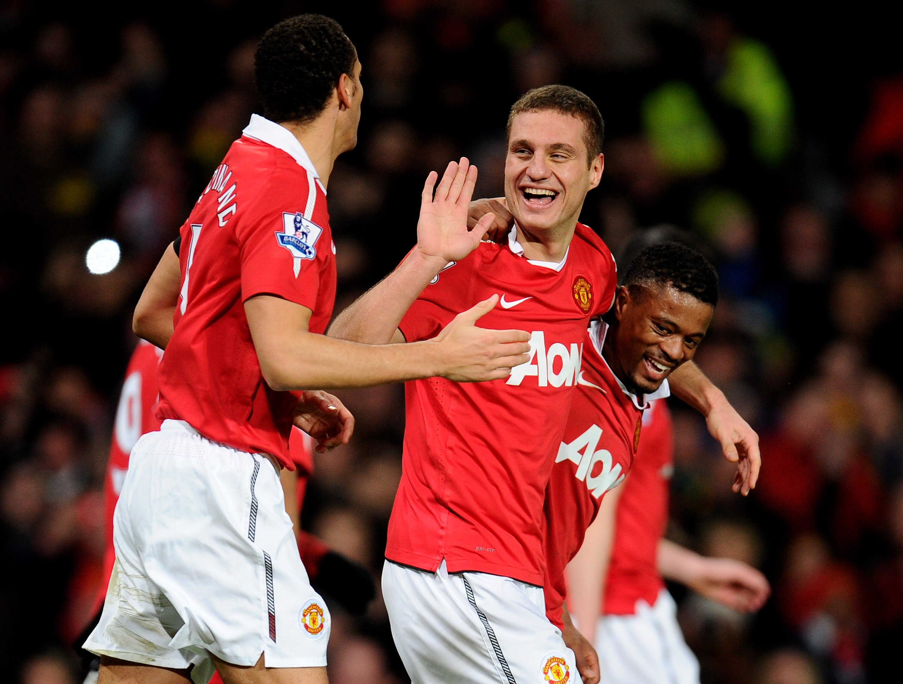 MANCHESTER, ENGLAND - FEBRUARY 01:  Nemanja Vidic of Manchester United celebrates scoring his team's third goal with team mates Rio Ferdinand and Patrice Evra (R) during the Barclays Premier League match between Manchester United and Aston Villa at Old Tr