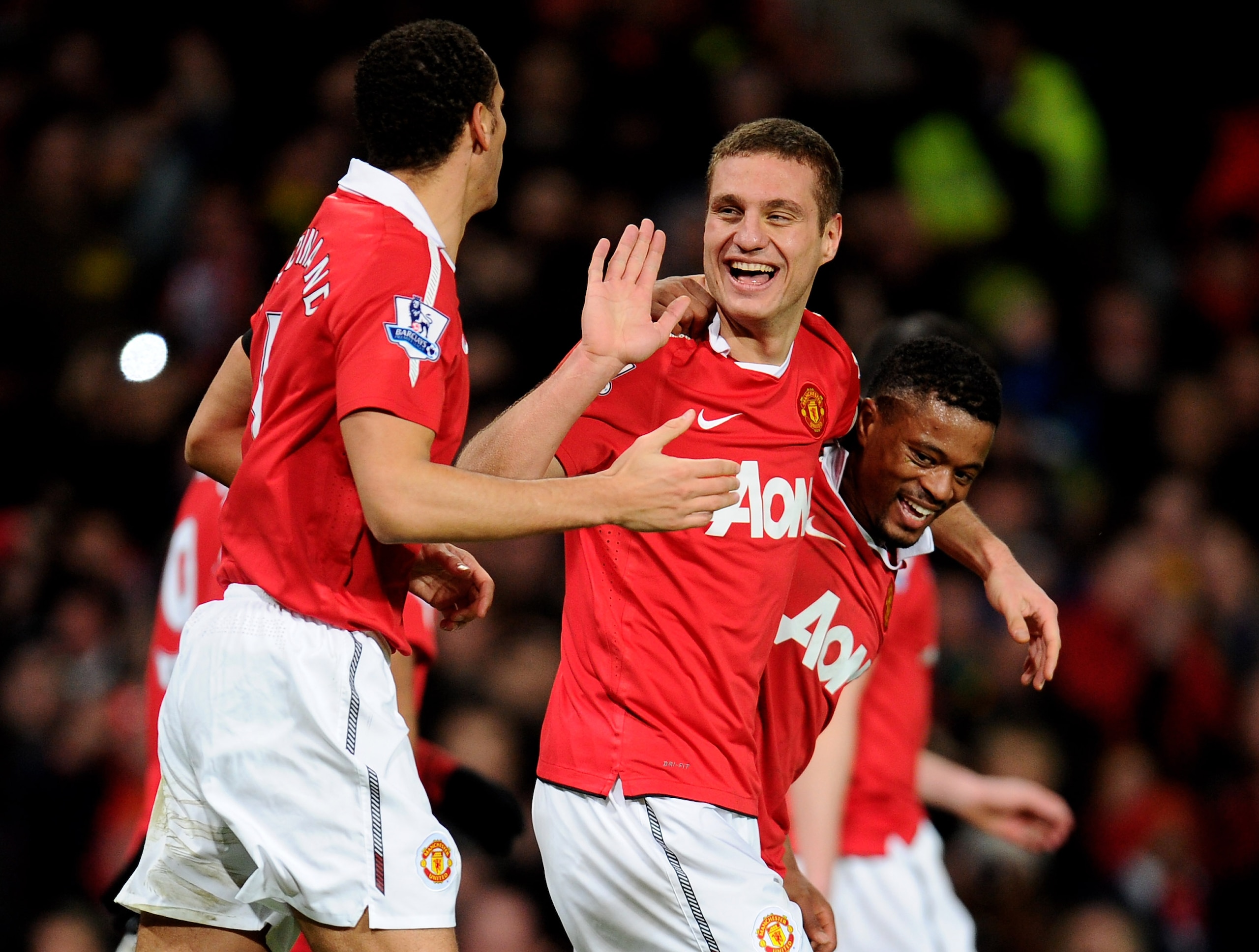 MANCHESTER, ENGLAND - FEBRUARY 01:  Nemanja Vidic of Manchester United celebrates scoring his team's third goal with team mates Rio Ferdinand and Patrice Evra (R) during the Barclays Premier League match between Manchester United and Aston Villa at Old Tr