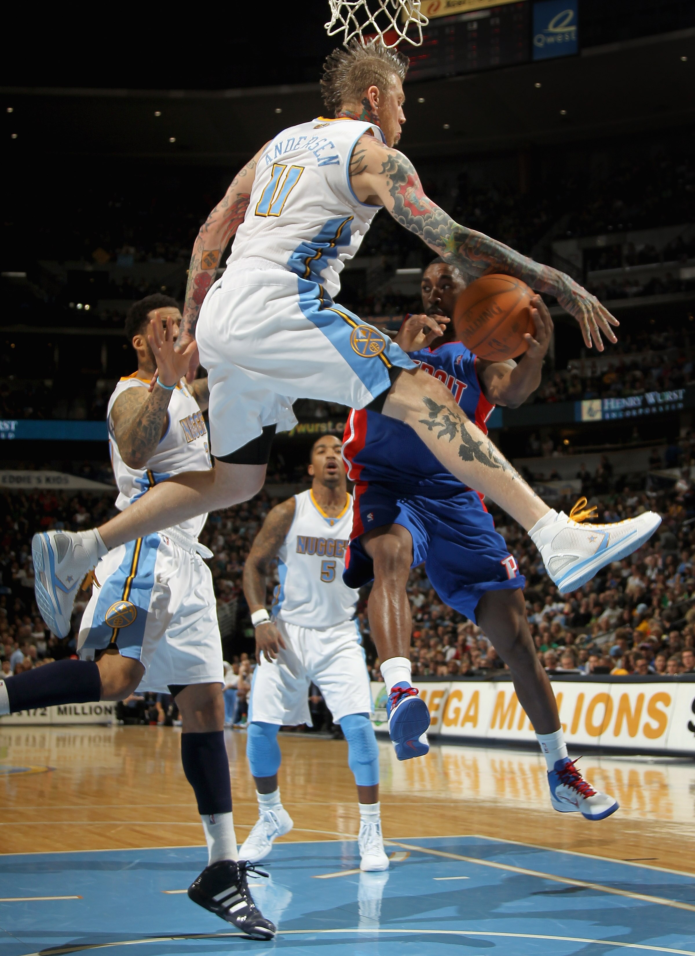 DENVER, CO - MARCH 12:  Chris Andersen #11 of the Denver Nuggets guards the route to the basket as he defends against Ben Gordon #12 of the Detroit Pistons at the Pepsi Center on March 12, 2011 in Denver, Colorado. The Nuggets defeated the Pistons 131-101