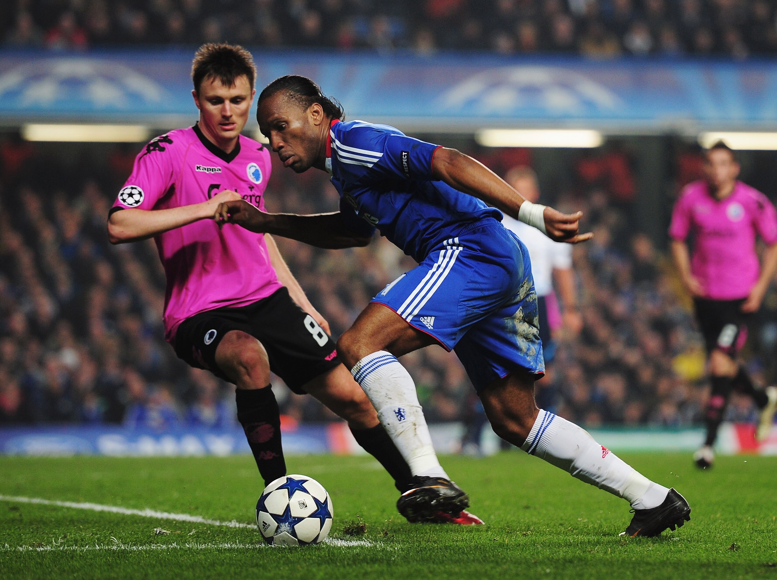 LONDON, UNITED KINGDOM - MARCH 16:  Didier Drogba (R) of Chelsea takes on William Kvist (L) of FC Copenhagen during the UEFA Champions League round of sixteen second leg match between Chelsea and FC Copenhagen at Stamford Bridge on March 16, 2011 in Londo