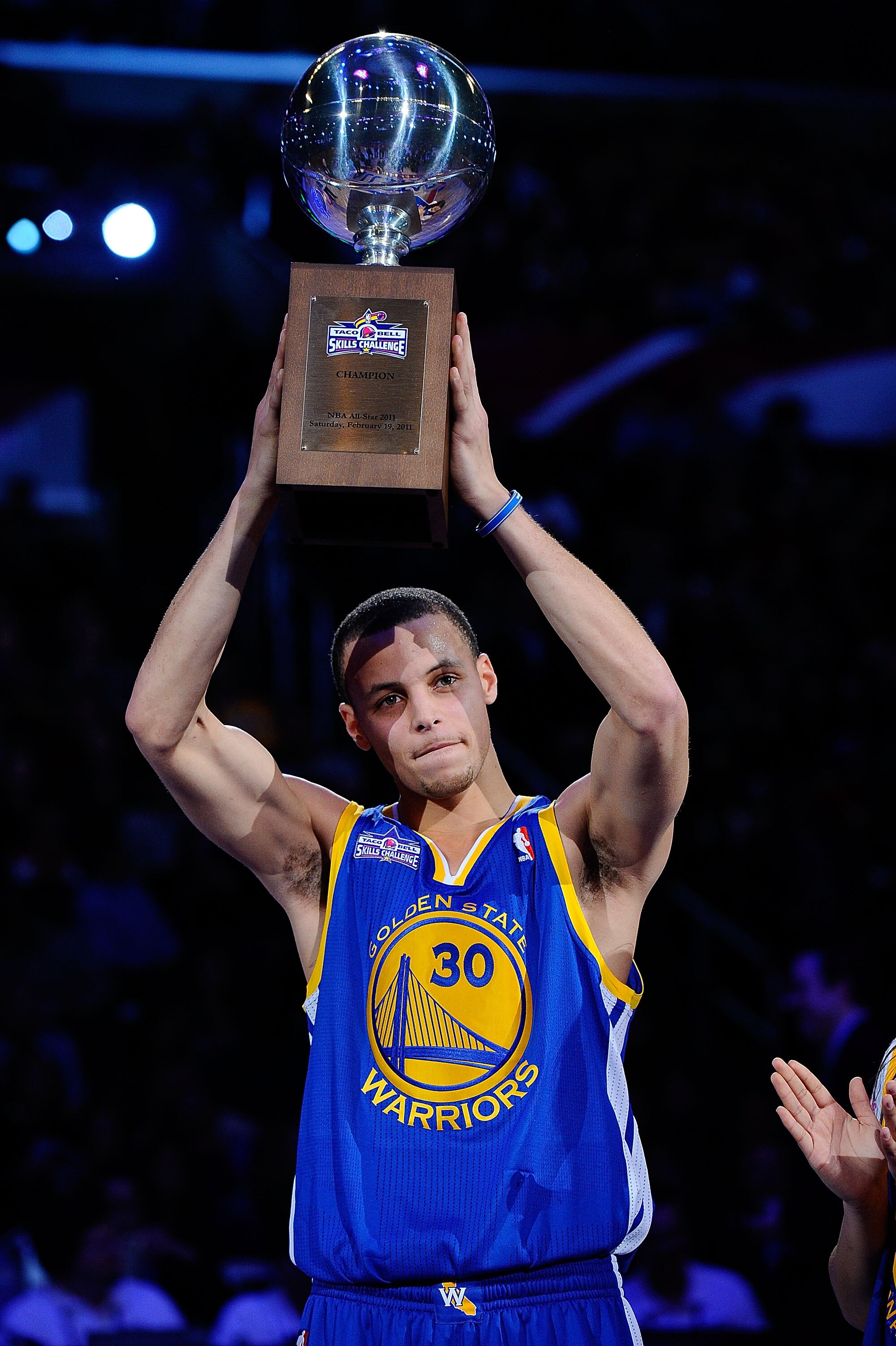 LOS ANGELES, CA - FEBRUARY 19:  Stephen Curry #30 of the Golden State Warriors holds up the trophy after winning the Taco Bell Skills Challenge apart of NBA All-Star Saturday Night at Staples Center on February 19, 2011 in Los Angeles, California.  (Photo